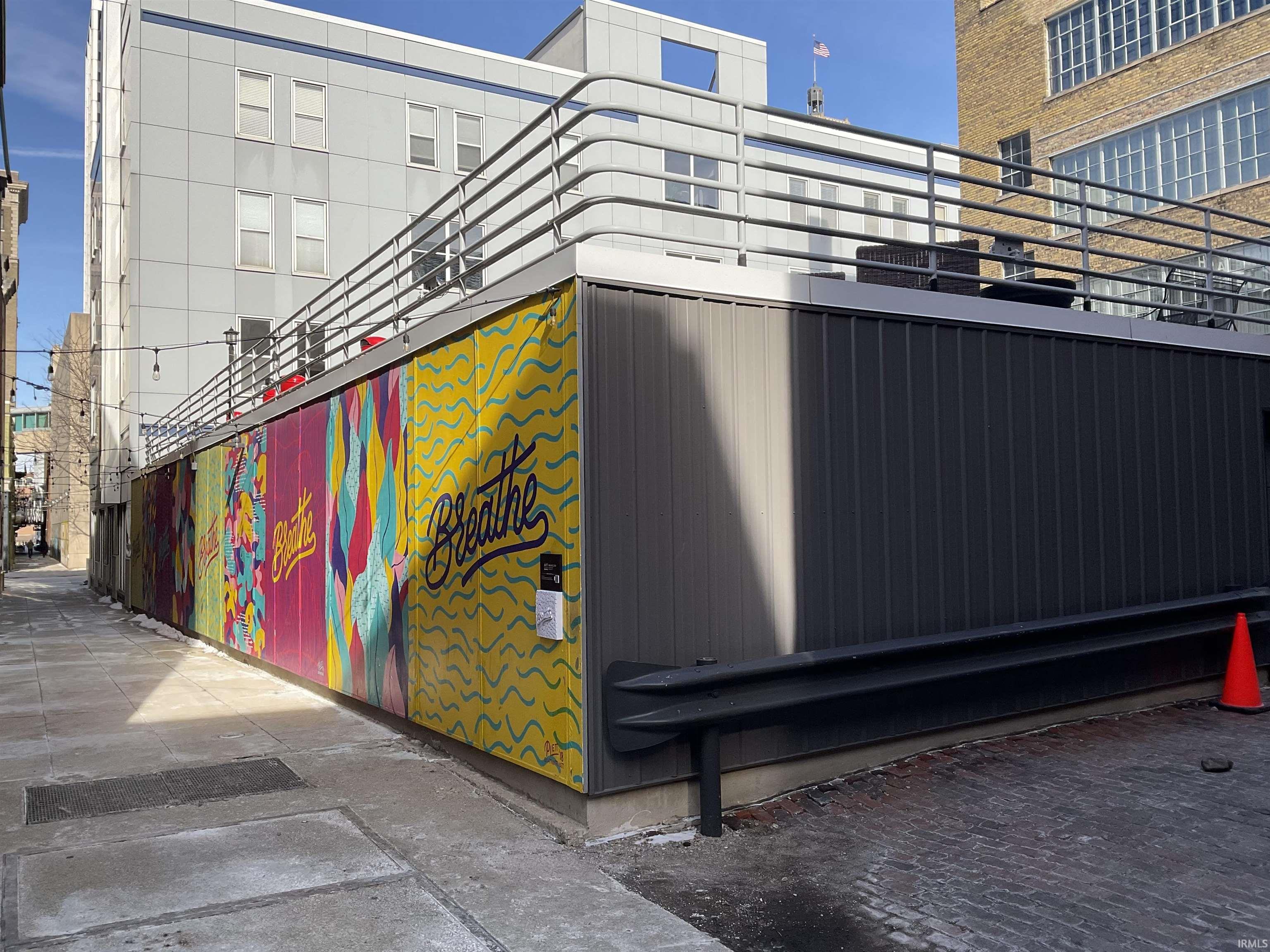 View of artwork below secured rooftop patio