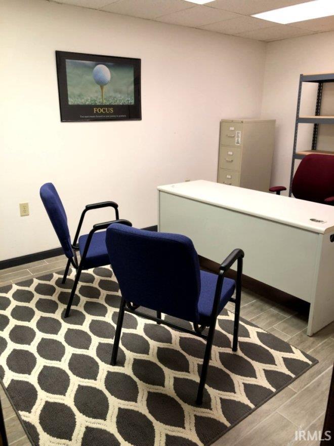 Office featuring a paneled ceiling