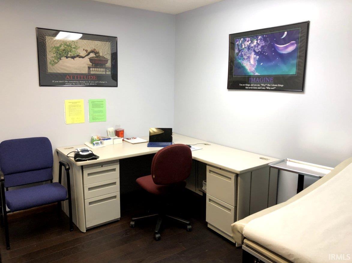 Office space with dark wood-style floors