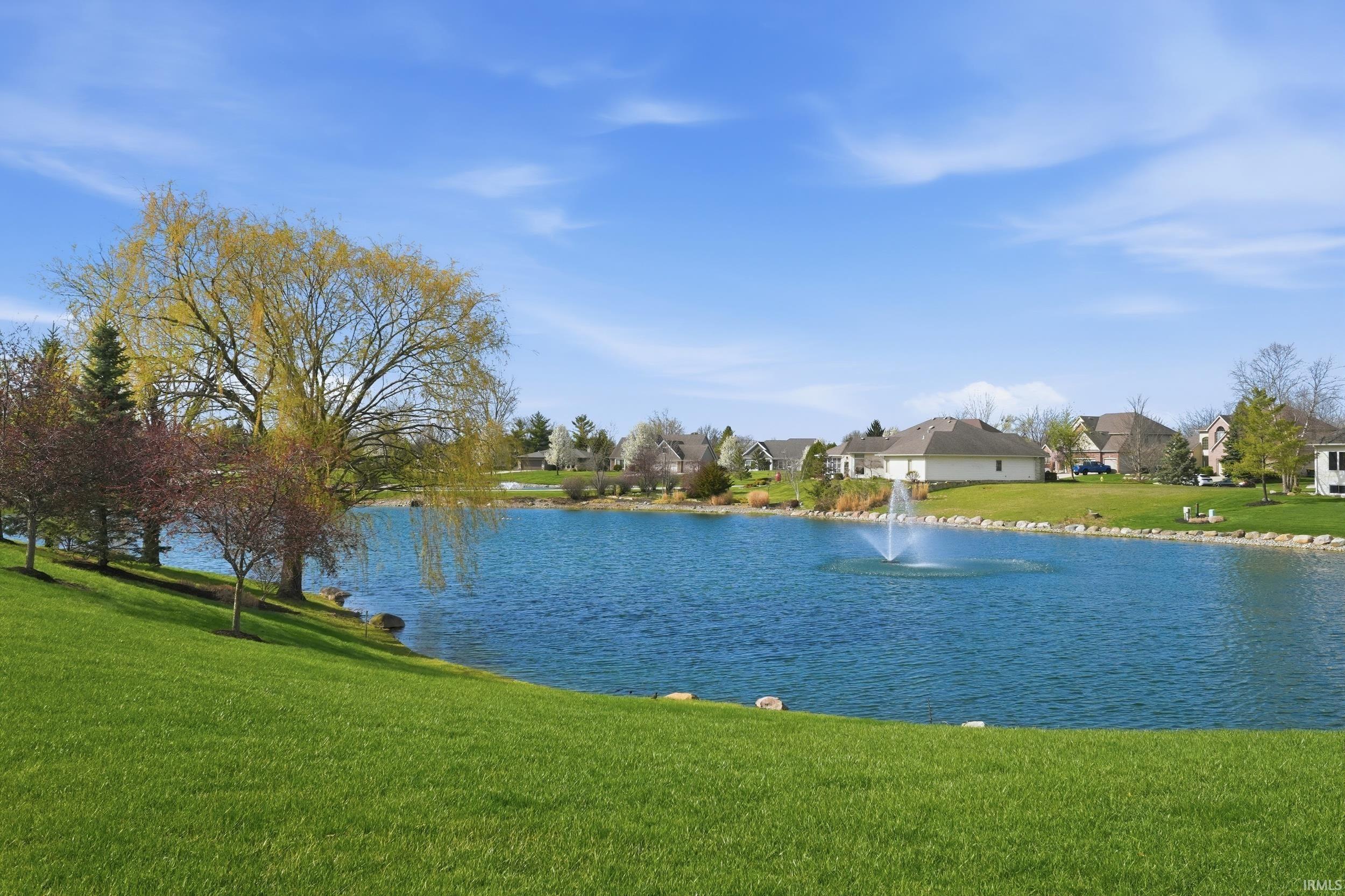 Water view featuring nearby suburban area