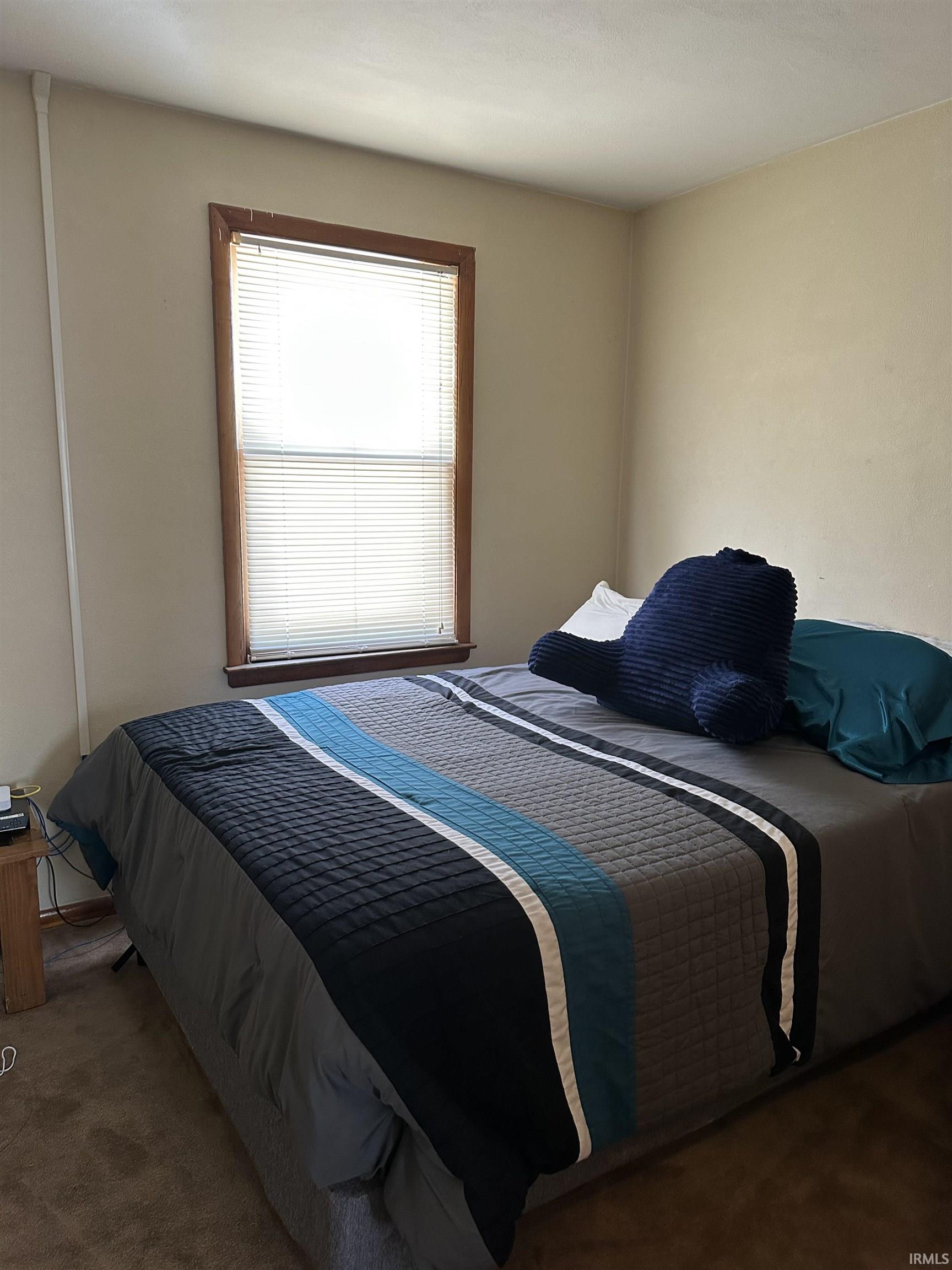 Bedroom with carpet flooring