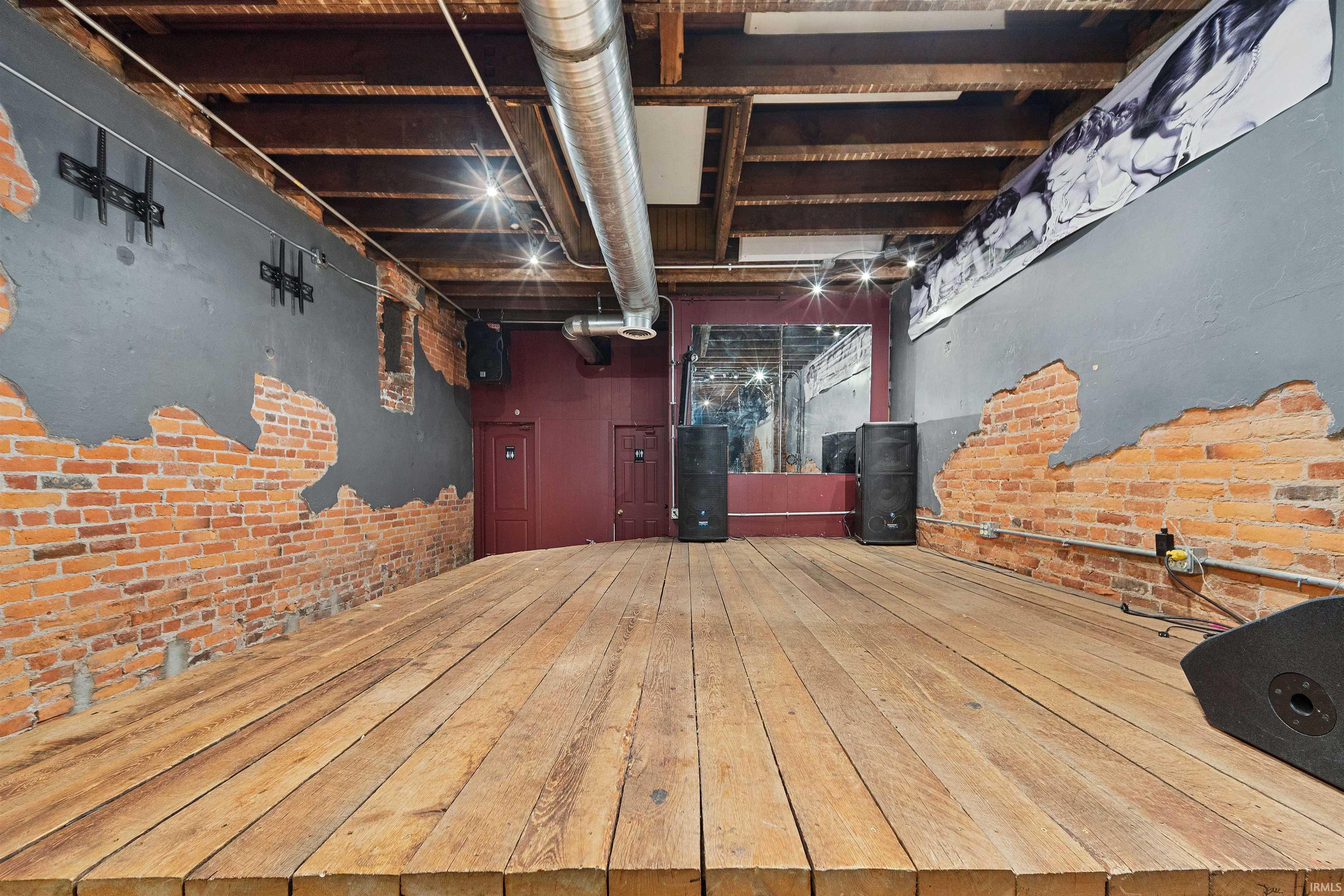 Unfinished basement with brick wall