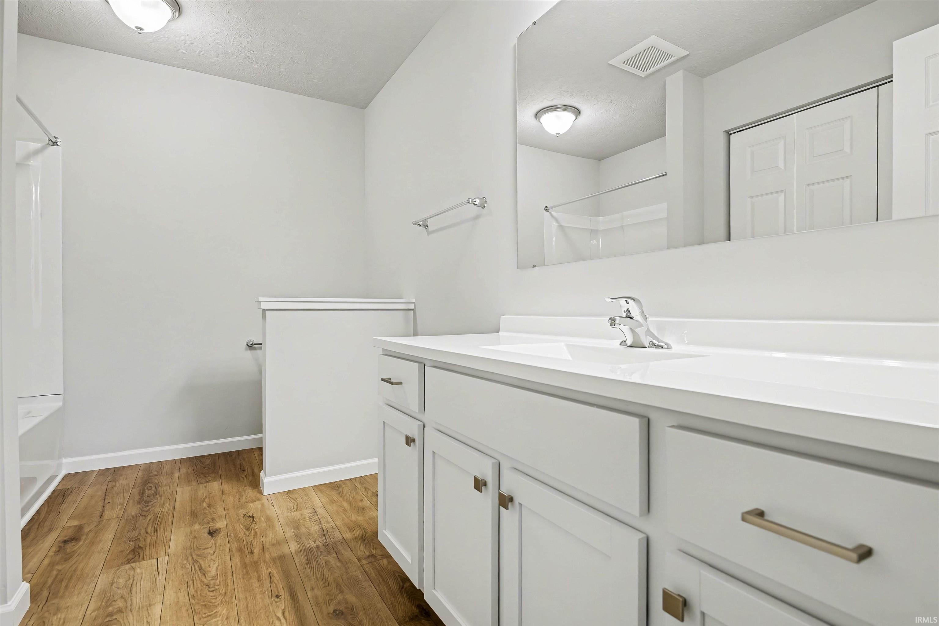 The private spa inspired bath features a dual vanity and oversized walk-in closet.