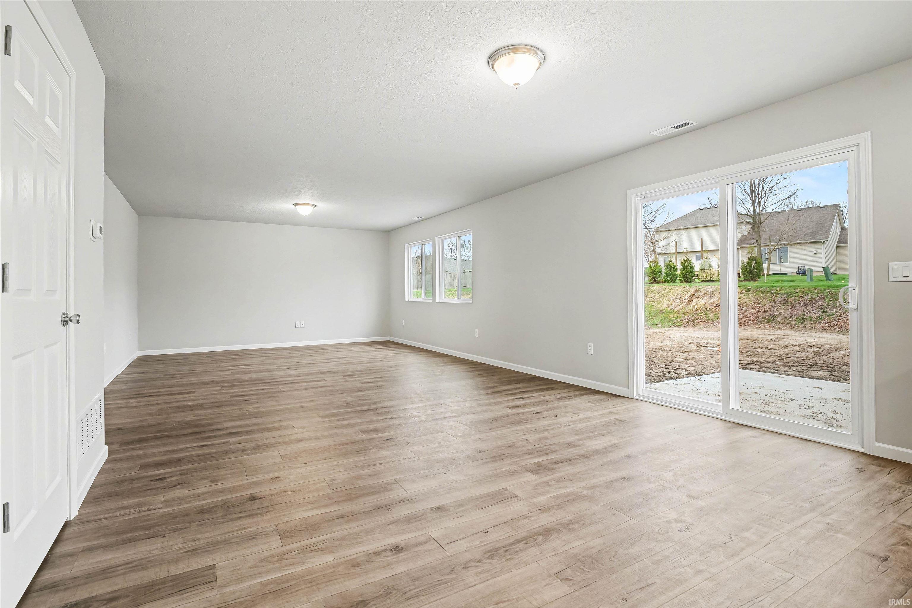 The dedicated dining room is an ideal gathering space since it can accommodate a large table and offers open sight lines into the kitchen and access to the rear yard.