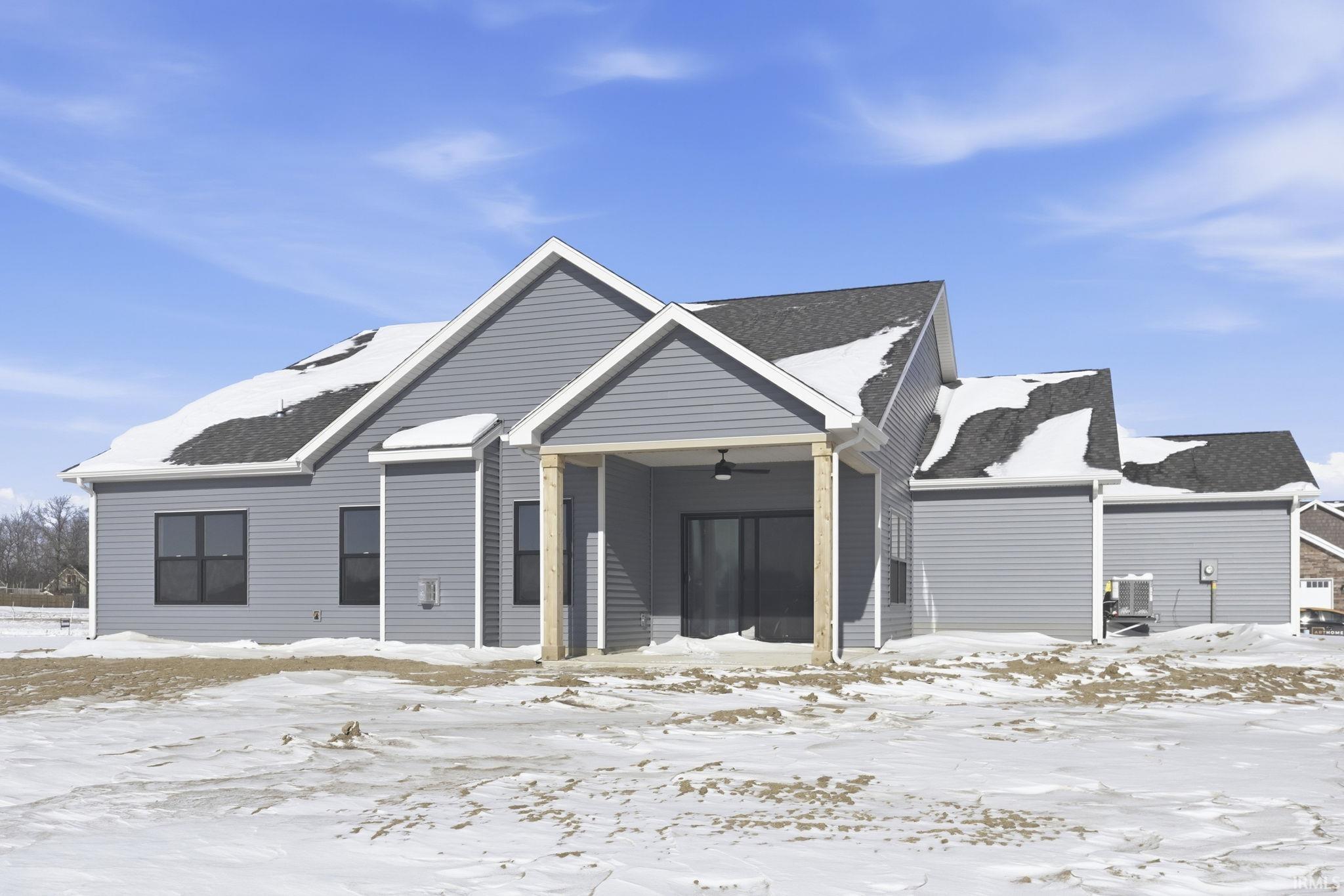Ranch-style home with ceiling fan, a patio, and a shingled roof