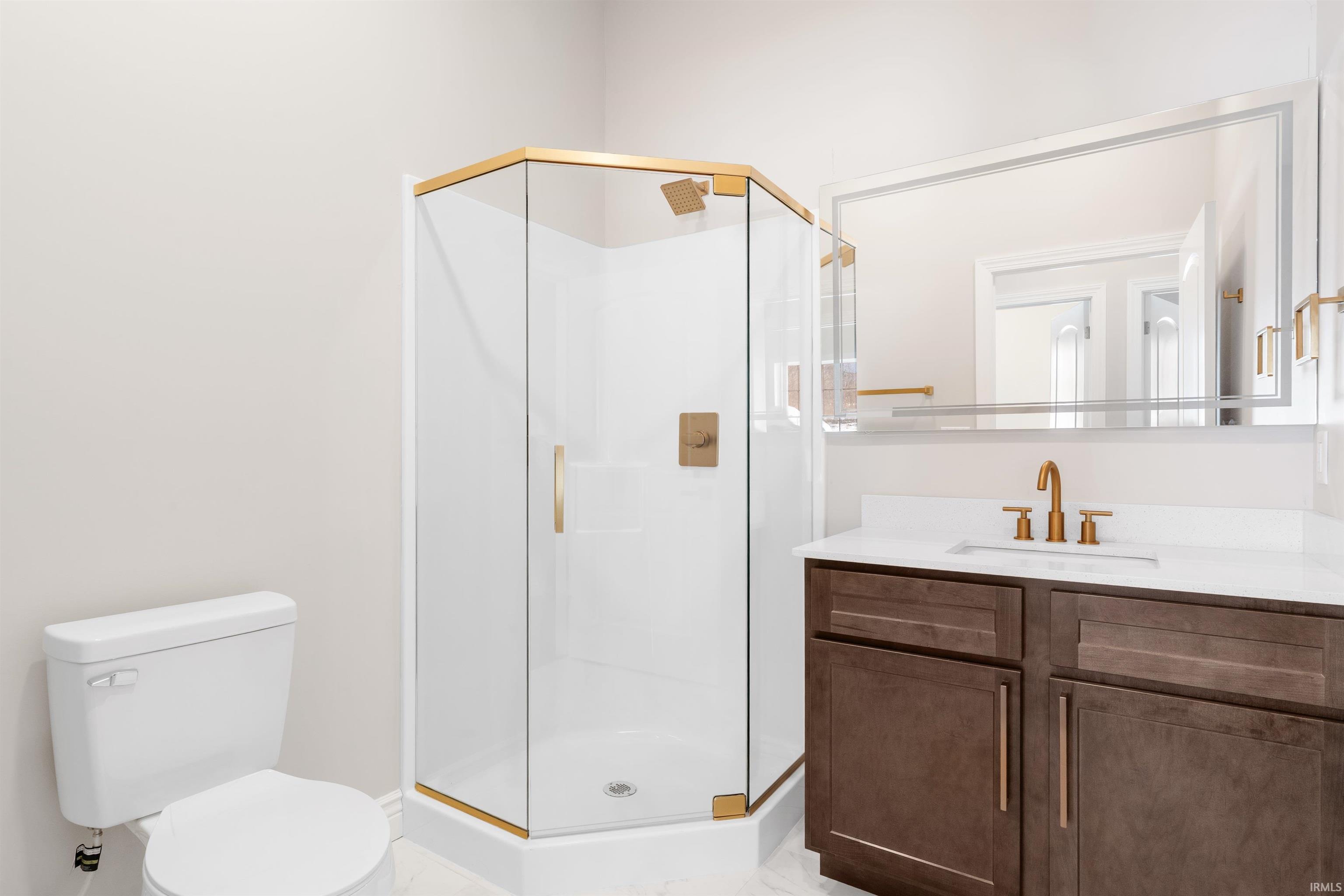 Full bathroom with a stall shower and vanity