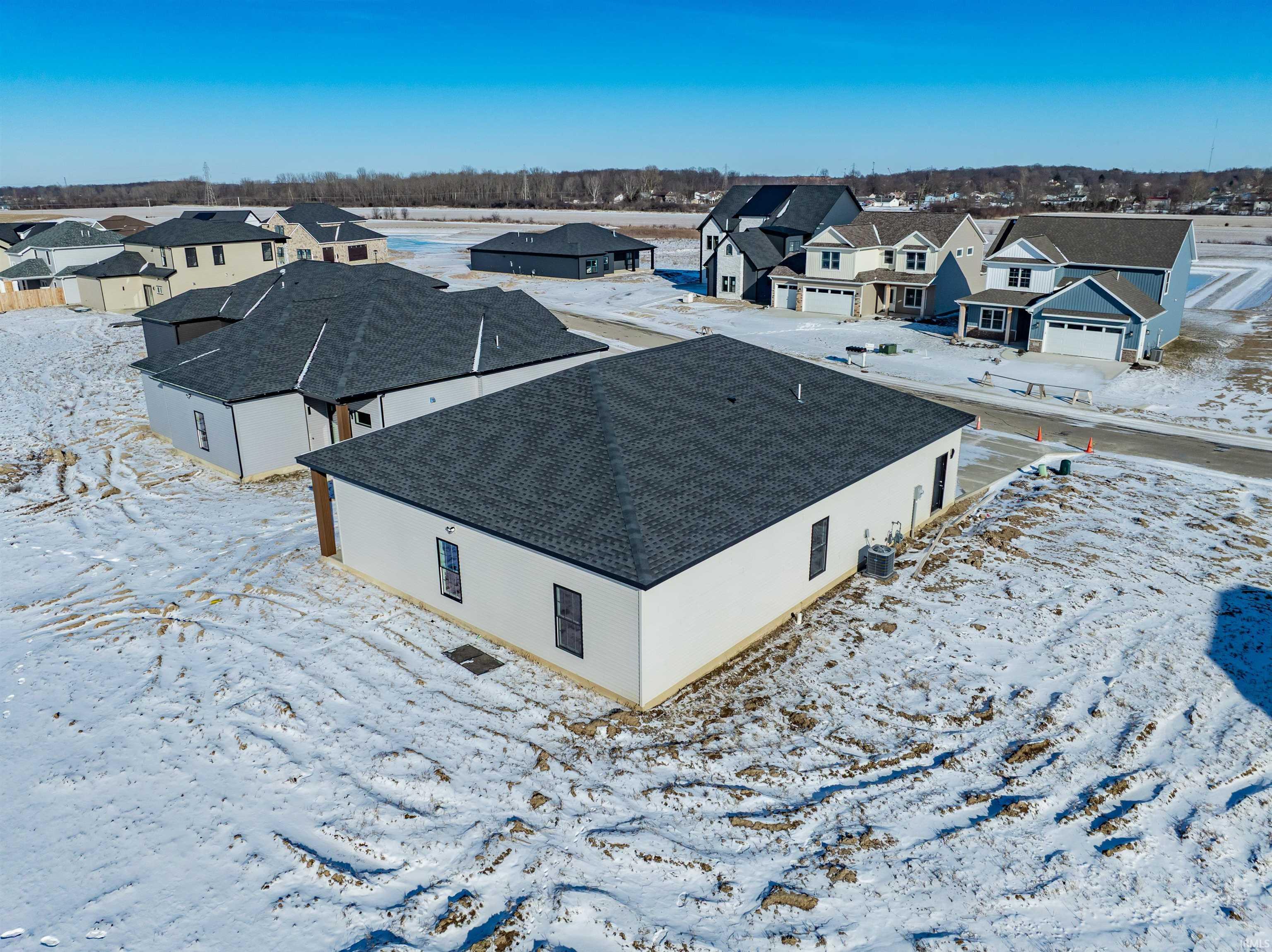 Snowy aerial view with a residential view