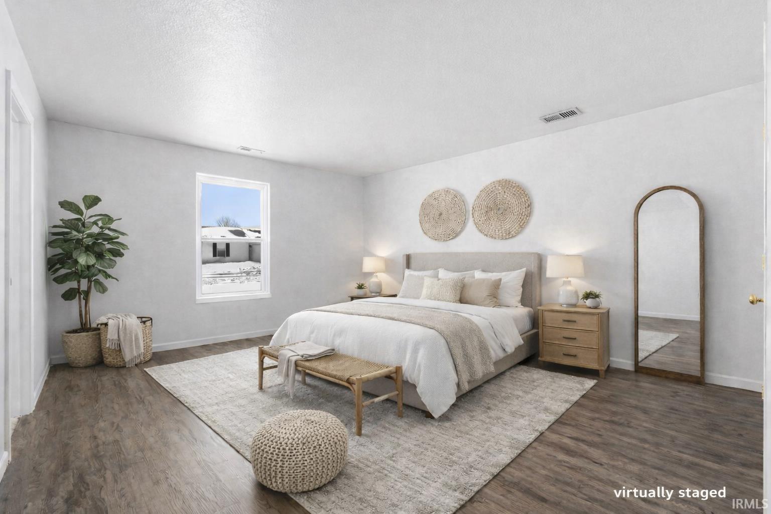 Bedroom featuring dark wood-style floors