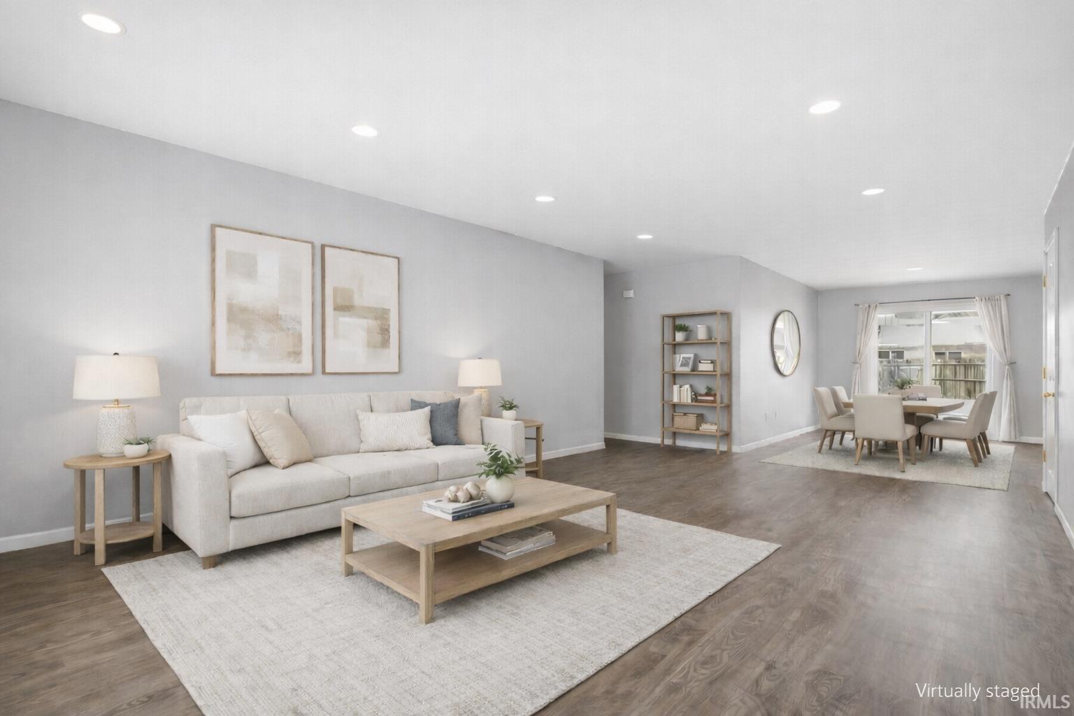Living room featuring dark wood-style floors and recessed lighting