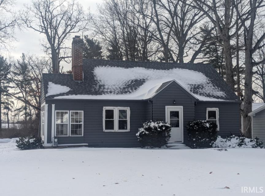 View of front of home with a chimney