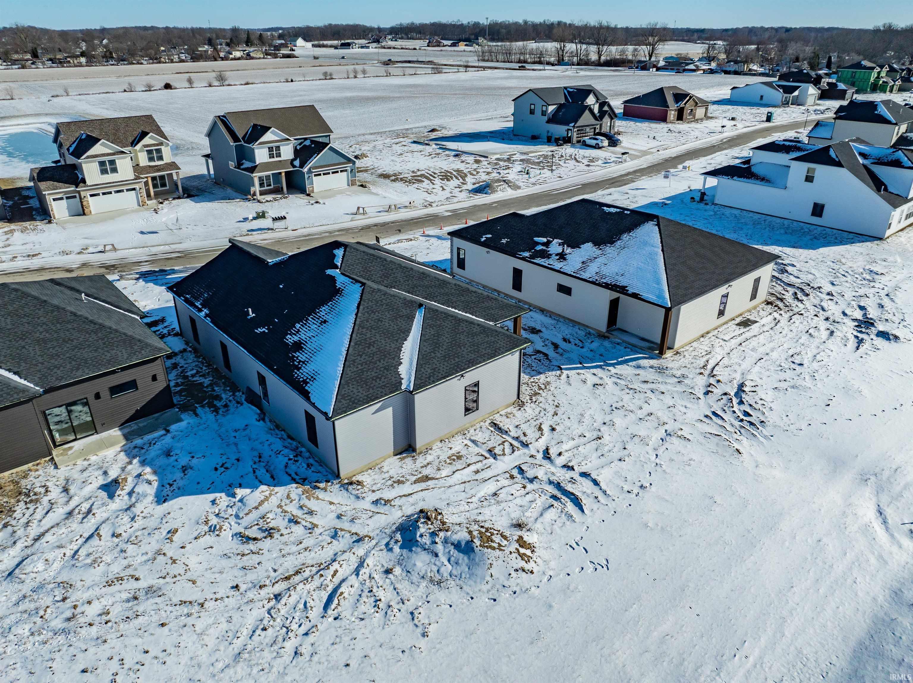 Snowy aerial view with a residential view