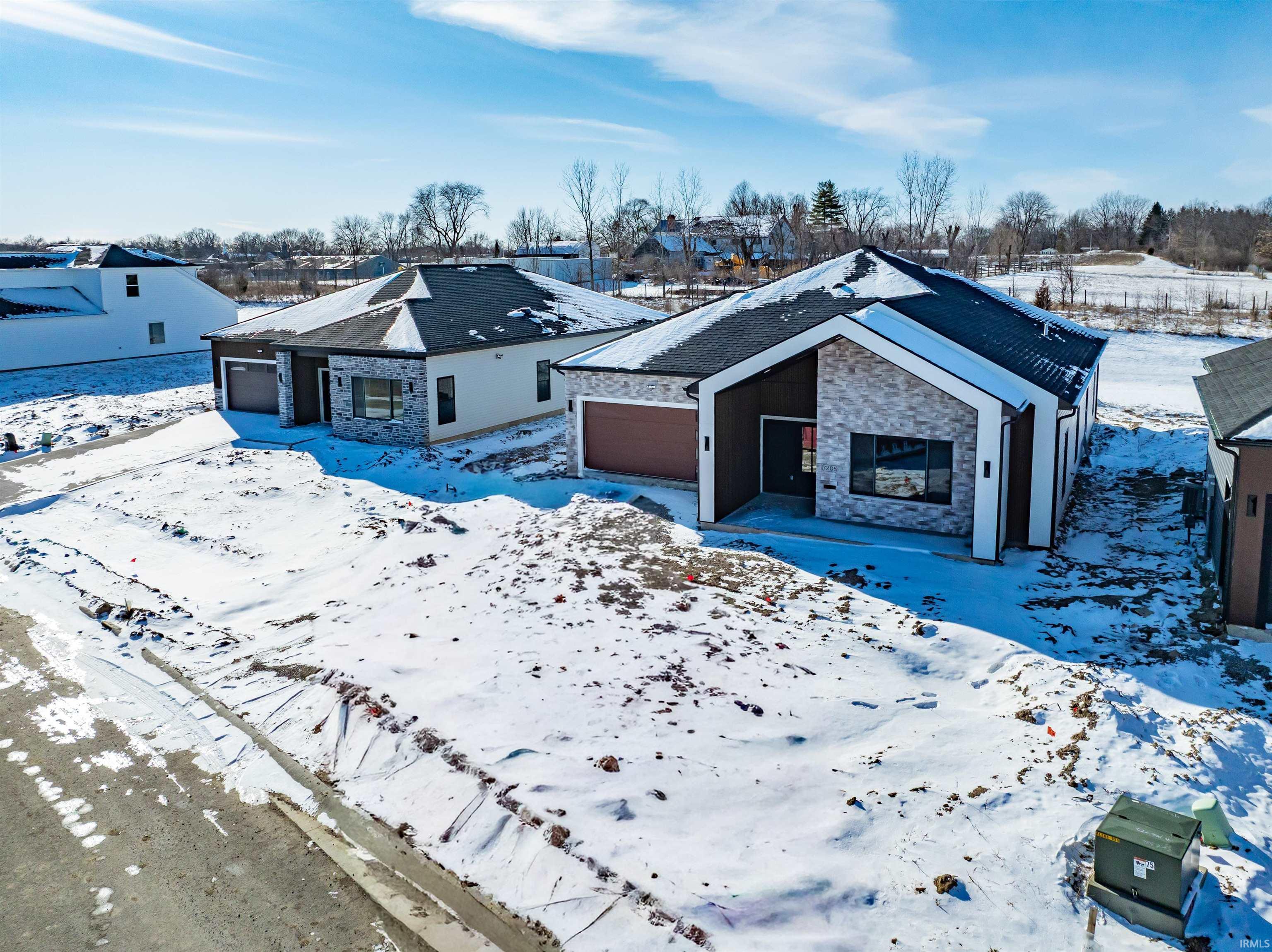 View of front of house with stone siding