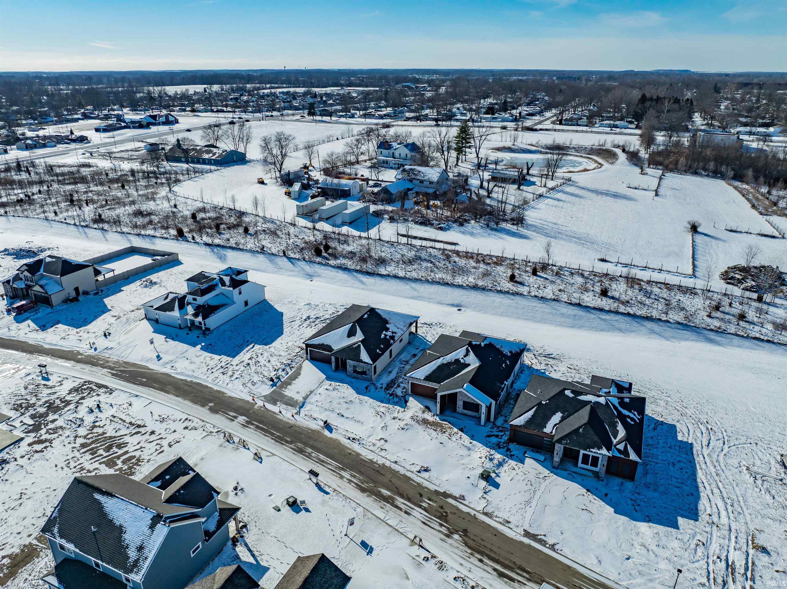 Snowy aerial view featuring a residential view