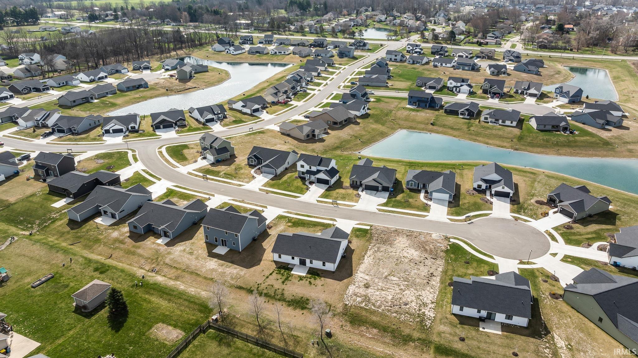 View of property location featuring nearby suburban area and a nearby body of water