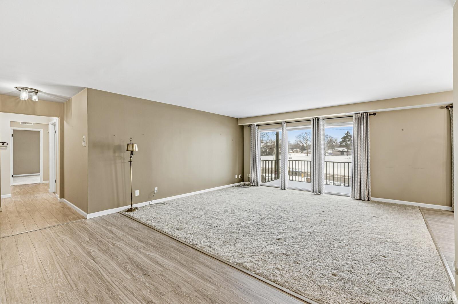 Empty room featuring light wood-type flooring and baseboards
