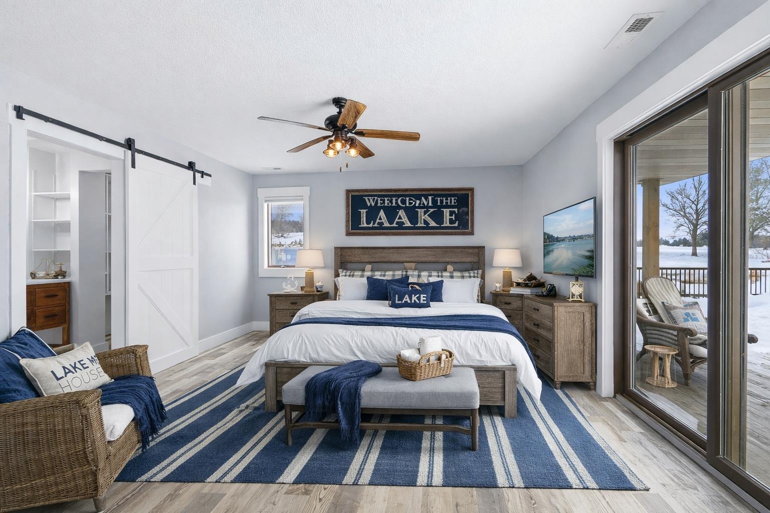 AI furniture generated - Bedroom featuring a barn door, access to exterior, light wood-style flooring, and a ceiling fan