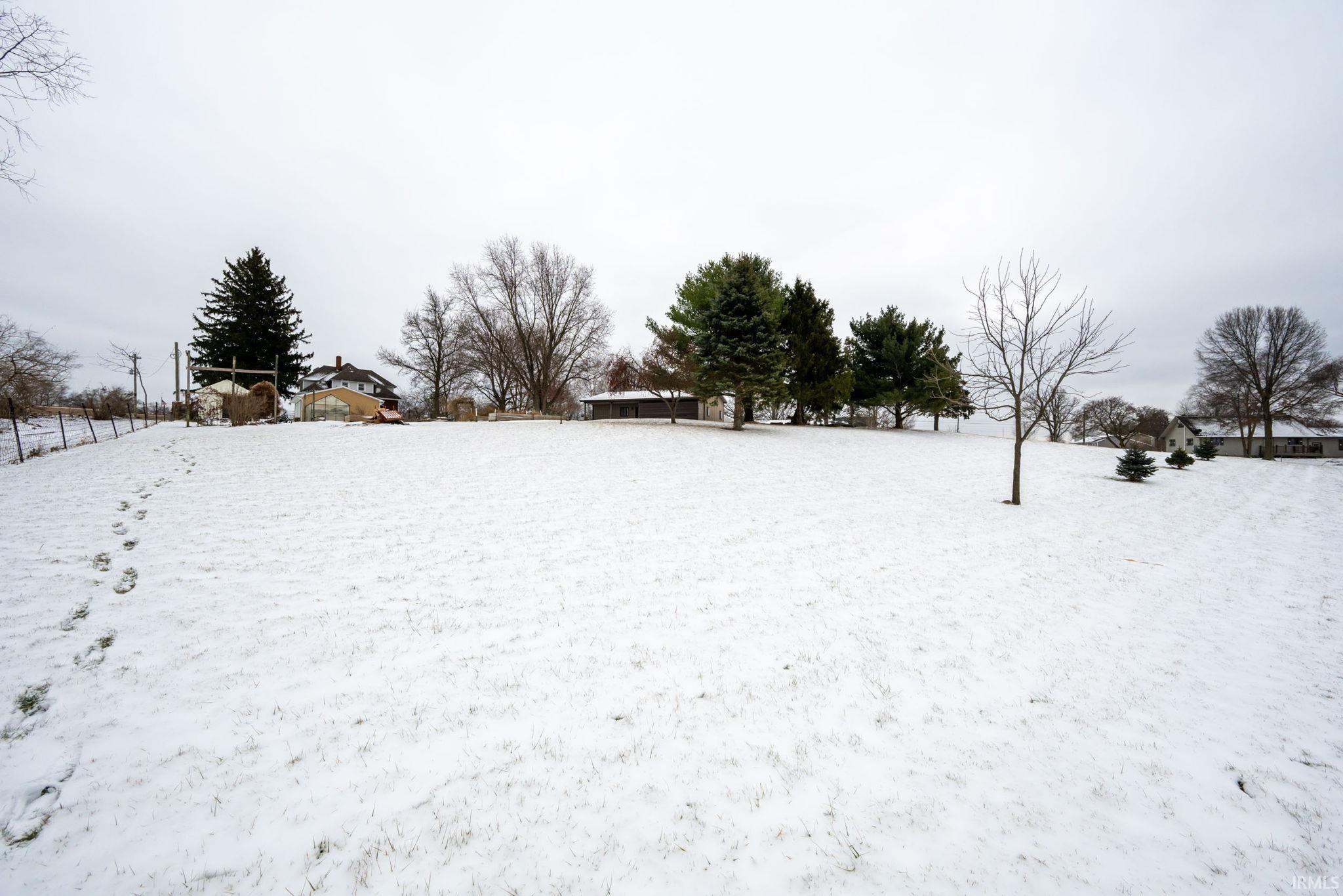 View of yard covered in snow