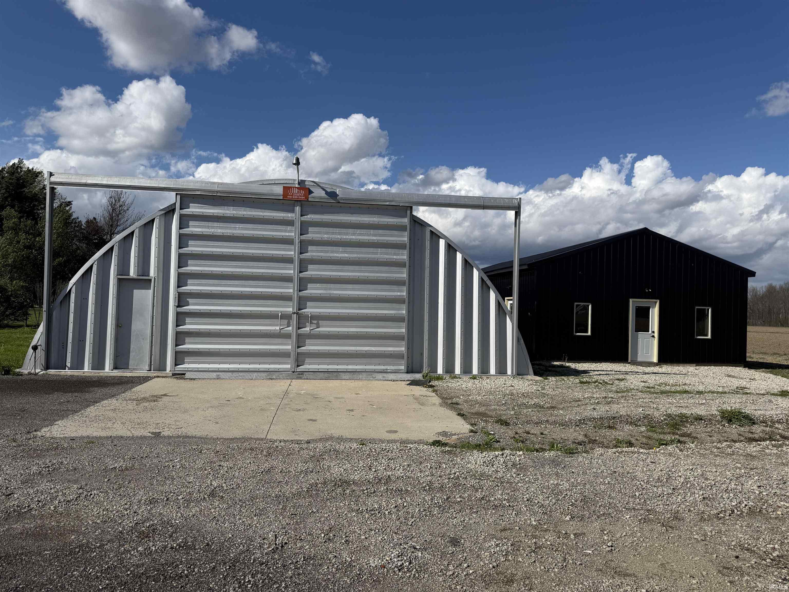Gate with an outbuilding