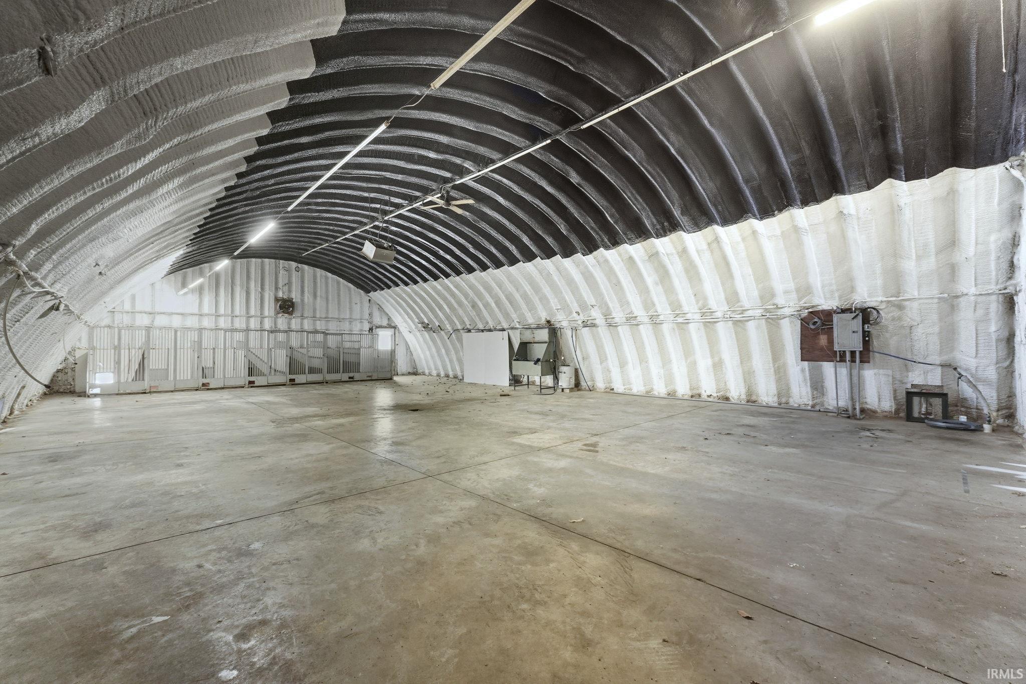 Misc room featuring vaulted ceiling and electric panel