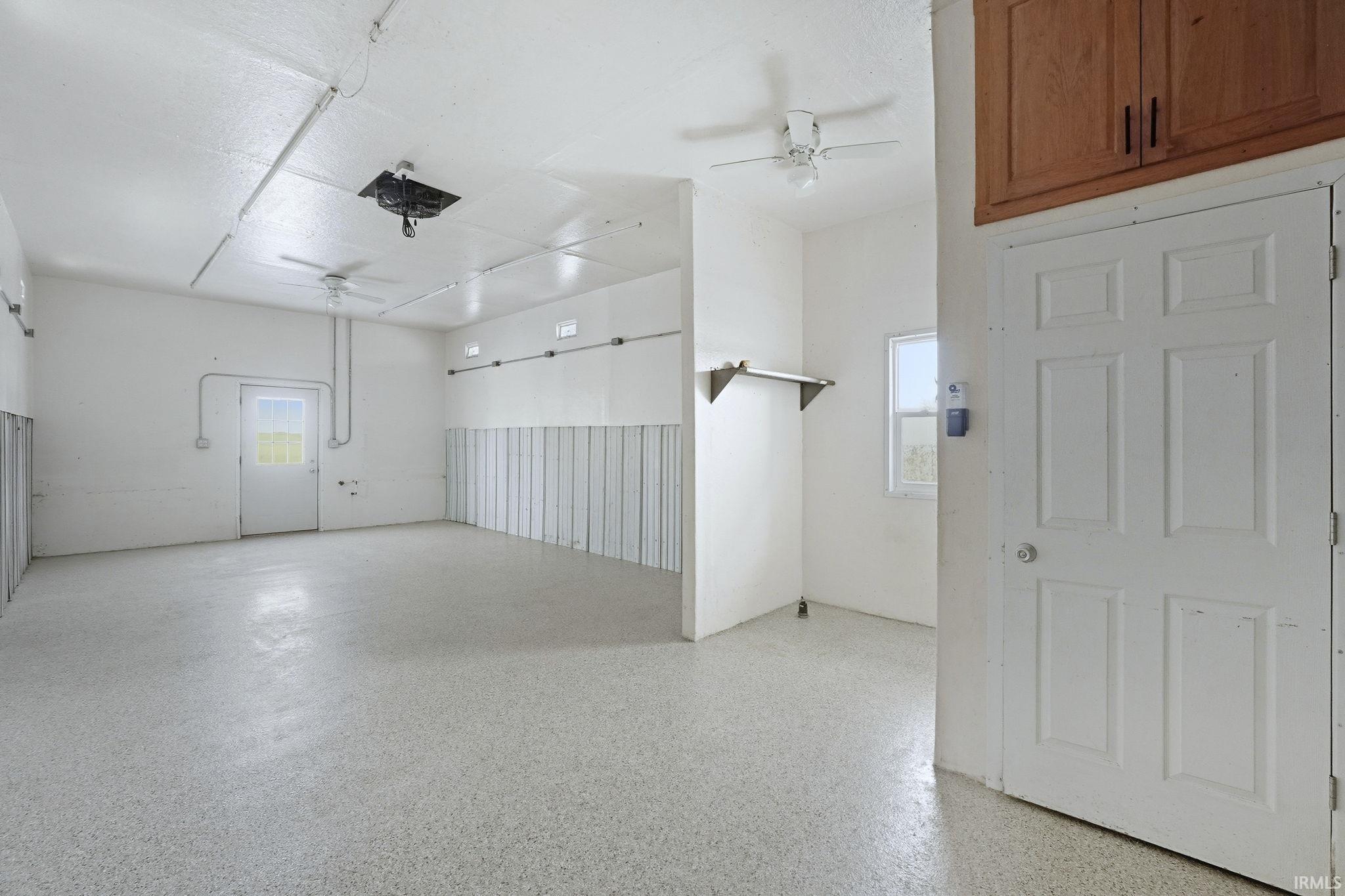Garage featuring ceiling fan