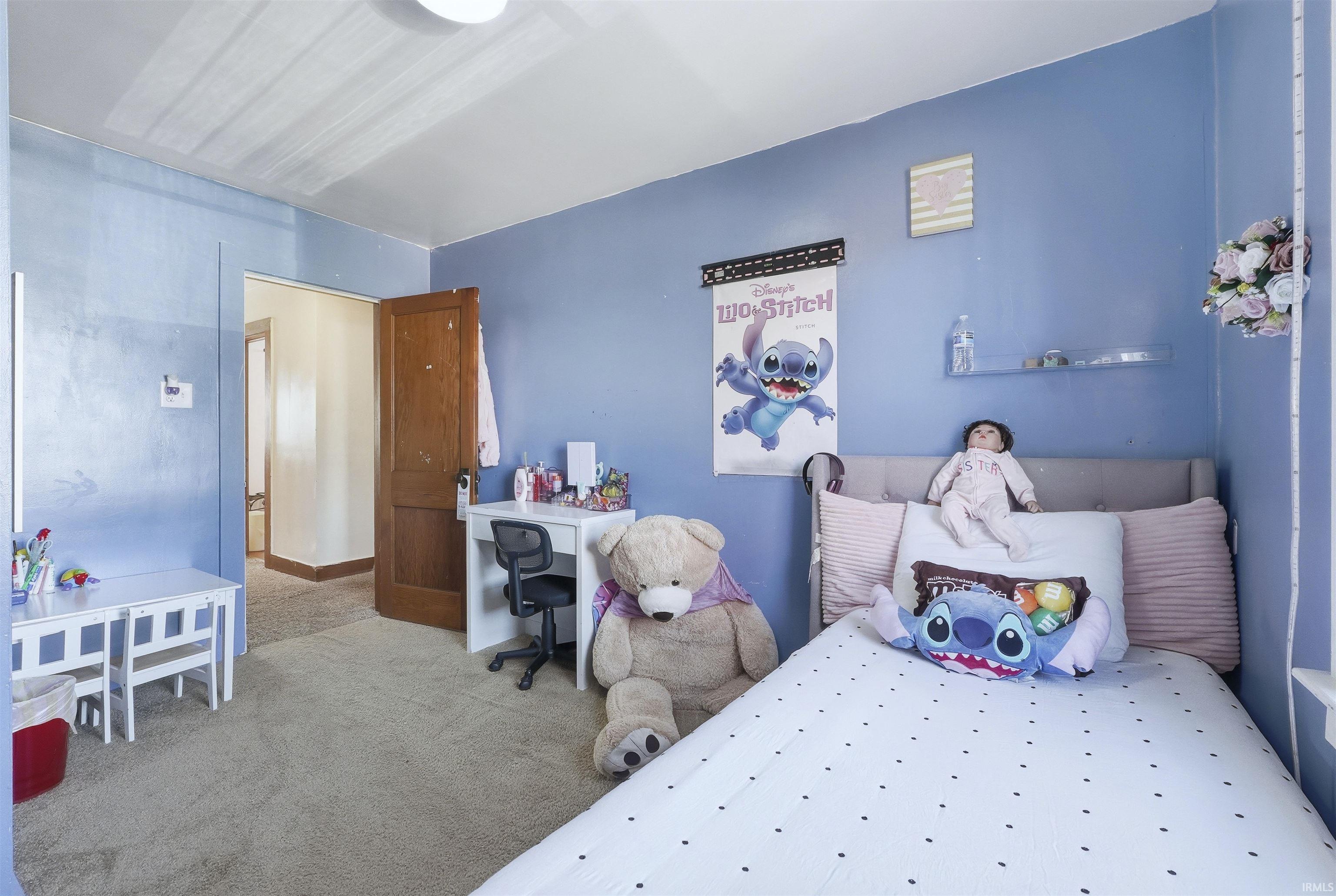 Bedroom featuring carpet flooring