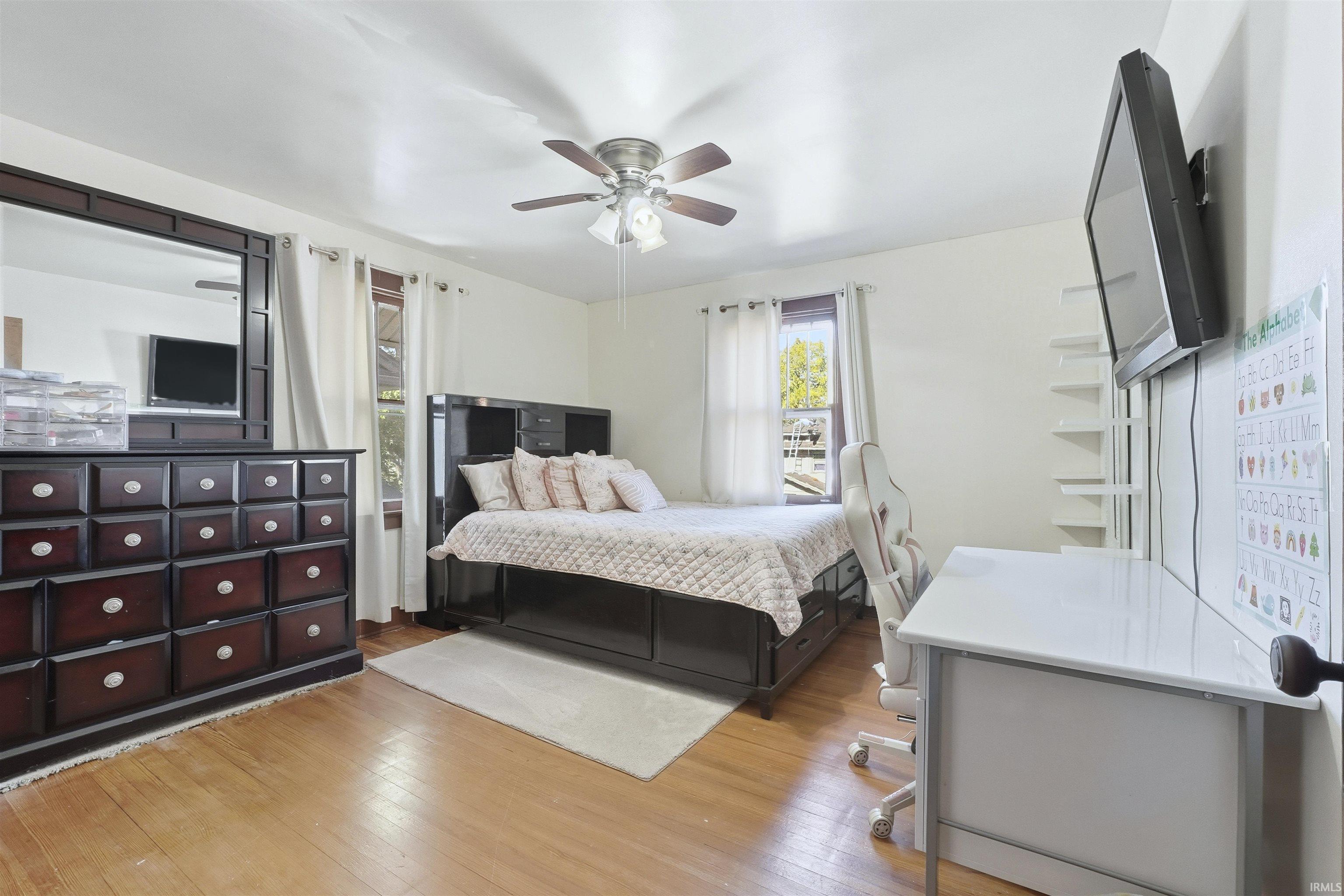 Bedroom featuring light wood-style floors and ceiling fan