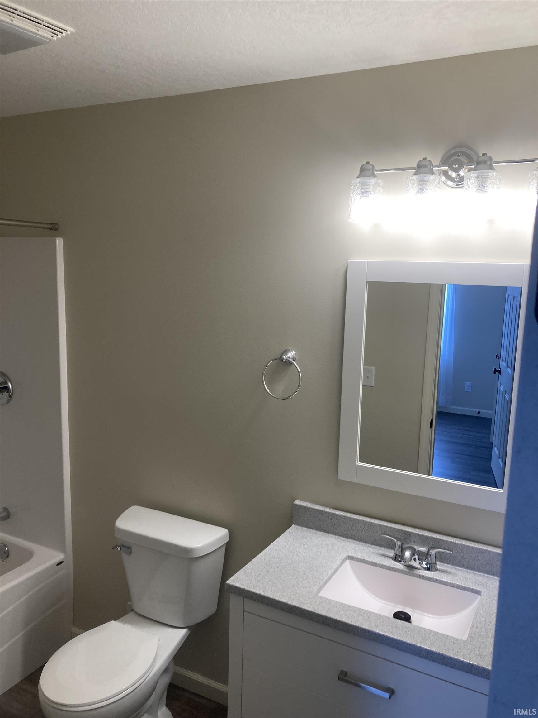 Full bathroom featuring vanity and bathtub / shower combination