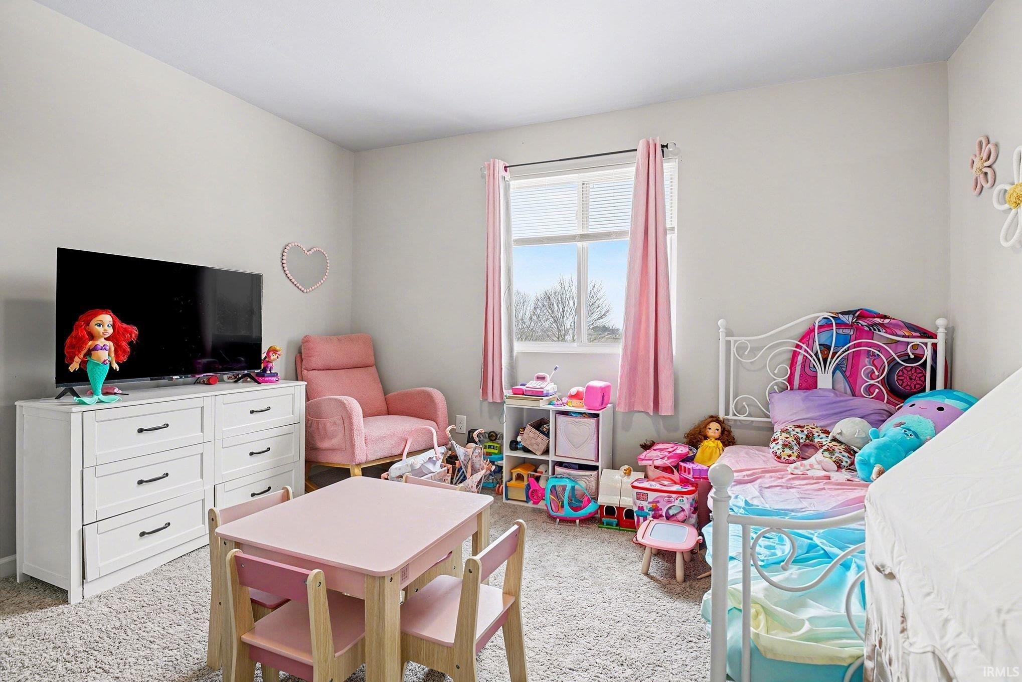 Bedroom with light carpet