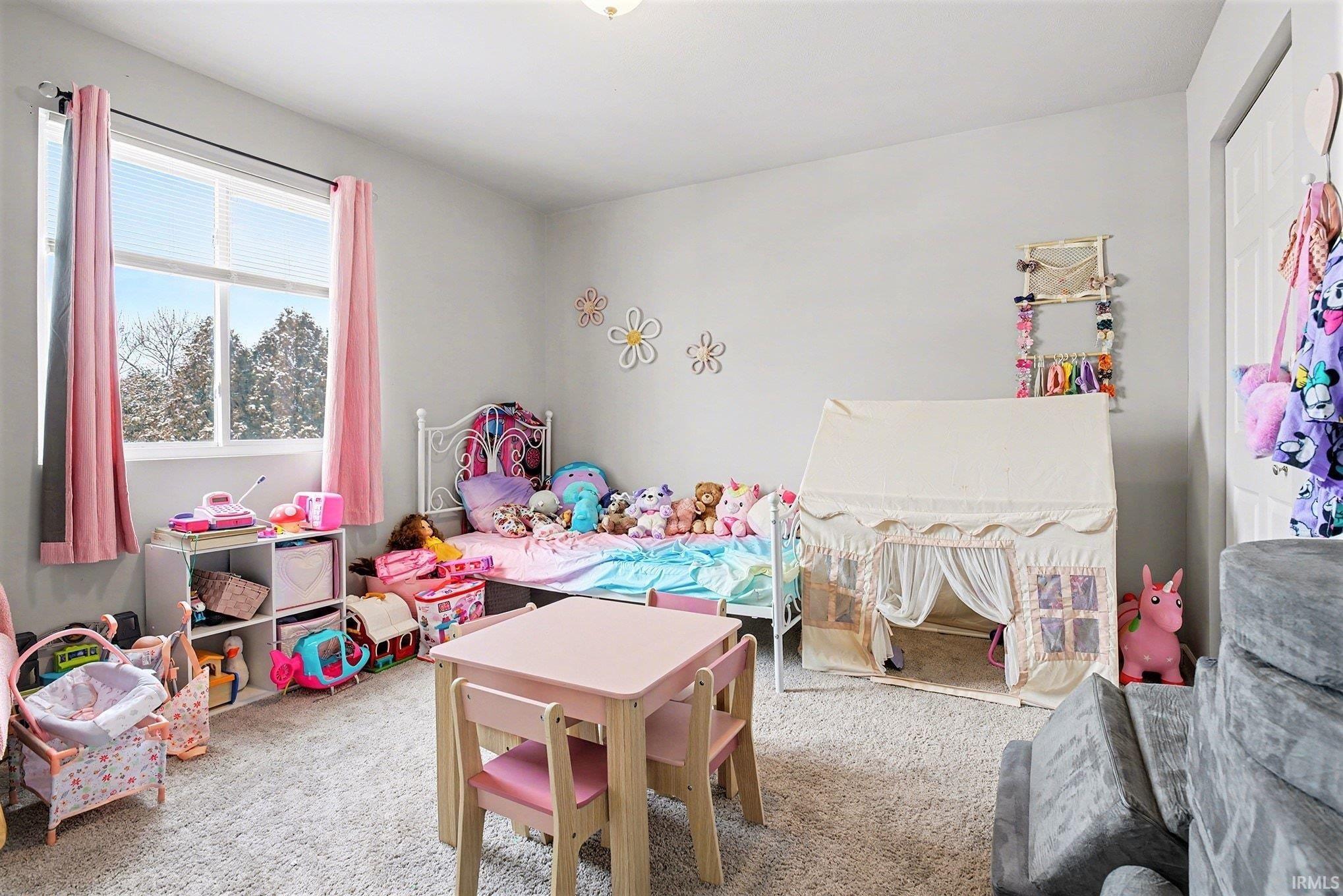 Bedroom featuring carpet floors
