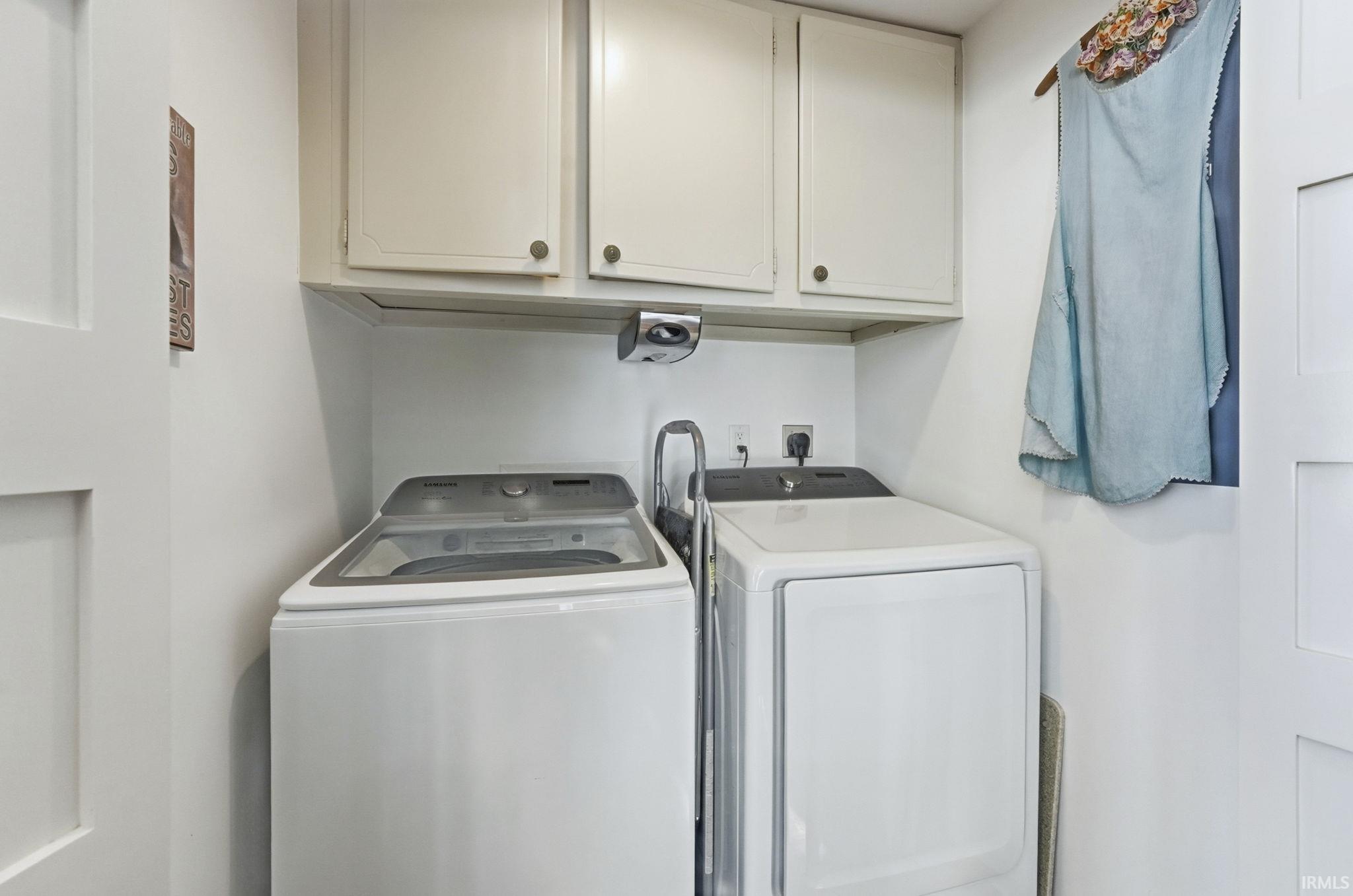 Laundry room featuring cabinet space and washing machine and dryer