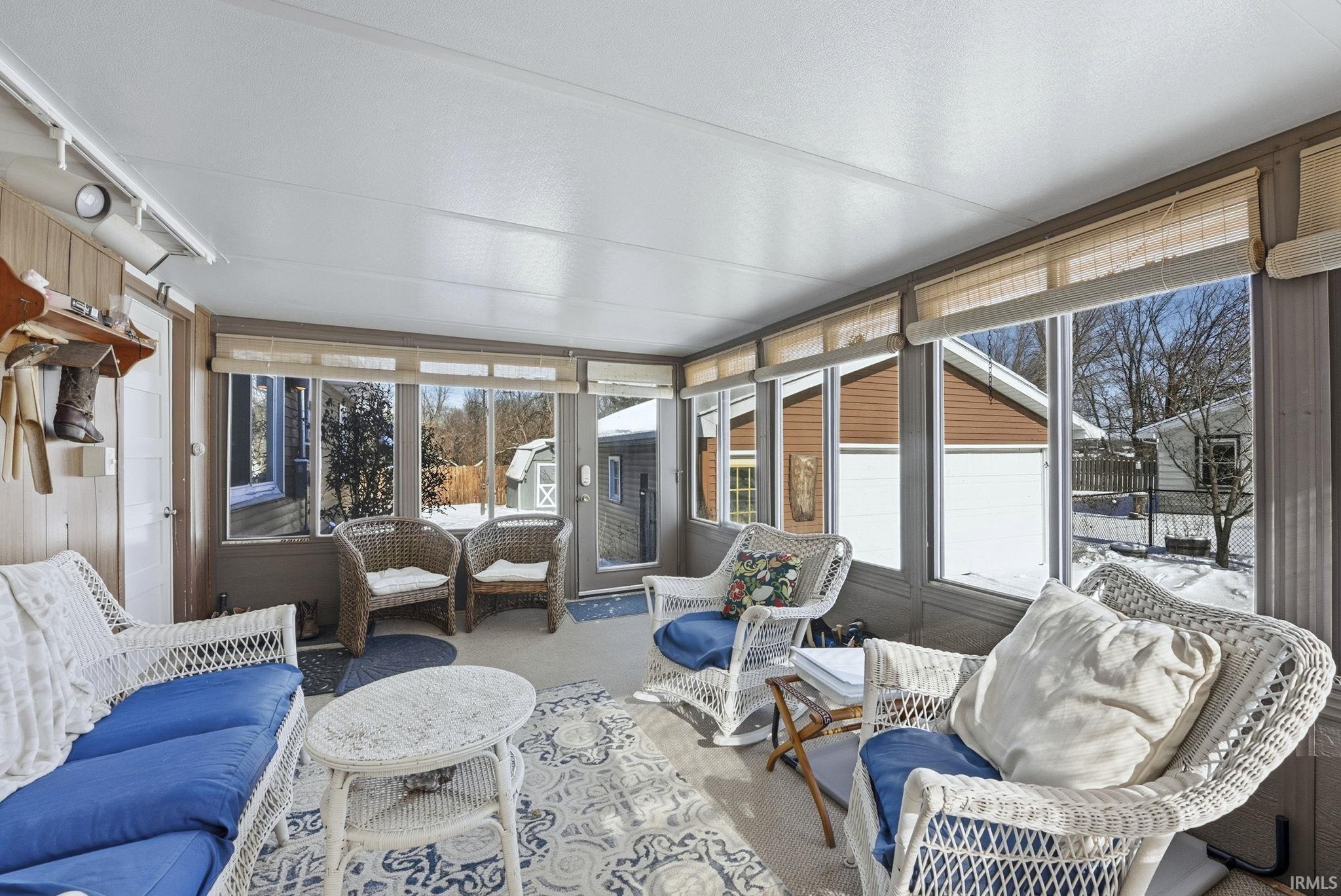 Sunroom / solarium with an outdoor living space