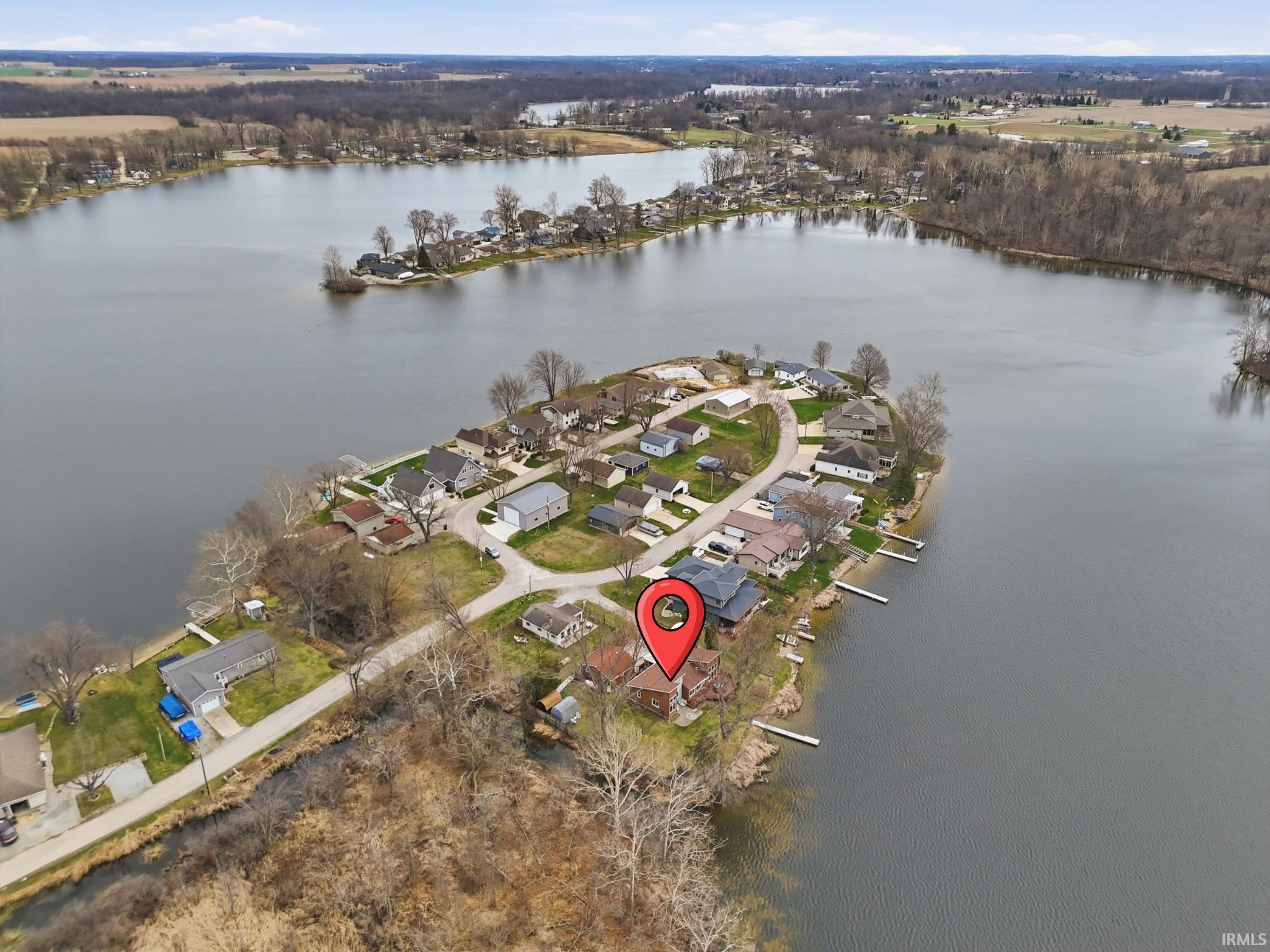 Aerial view of residential area featuring a large body of water