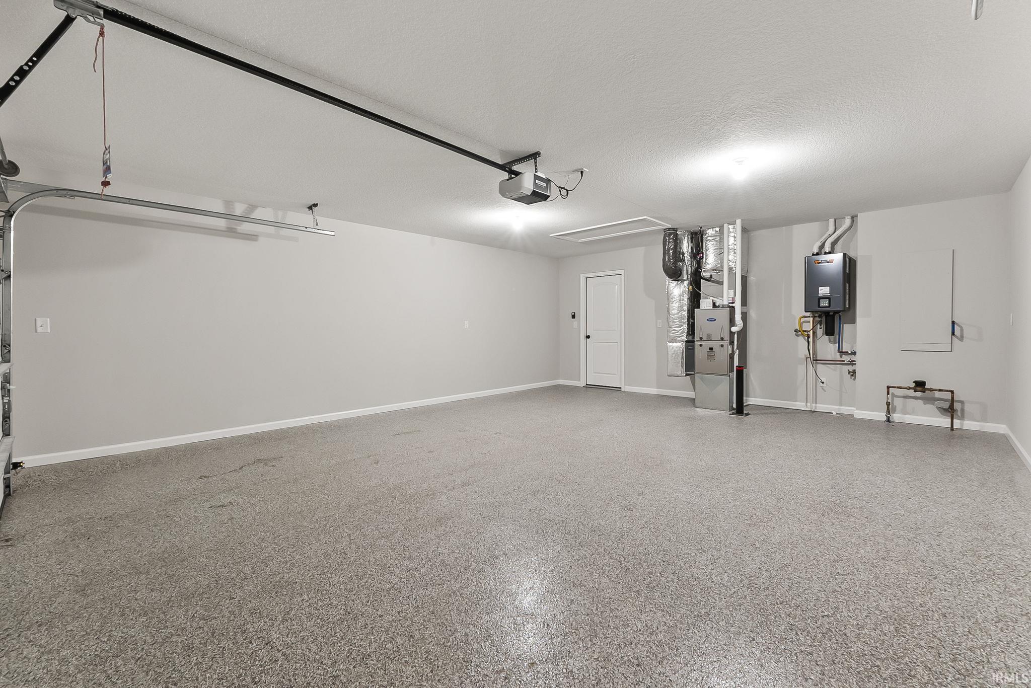 Garage with heating unit and baseboards