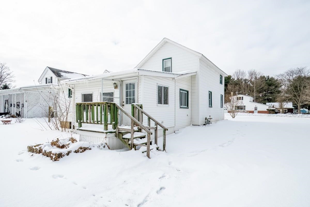 View of front of property featuring a deck