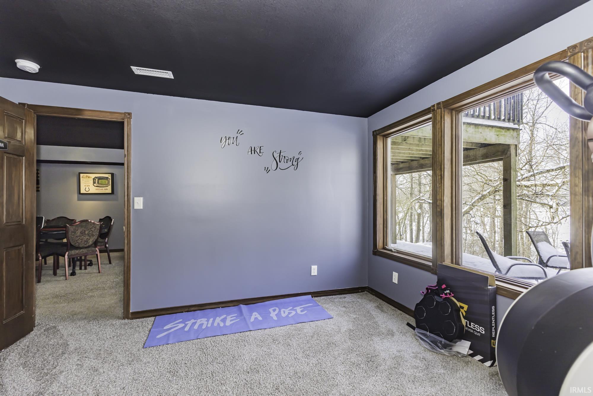 Office space featuring carpet floors and baseboards