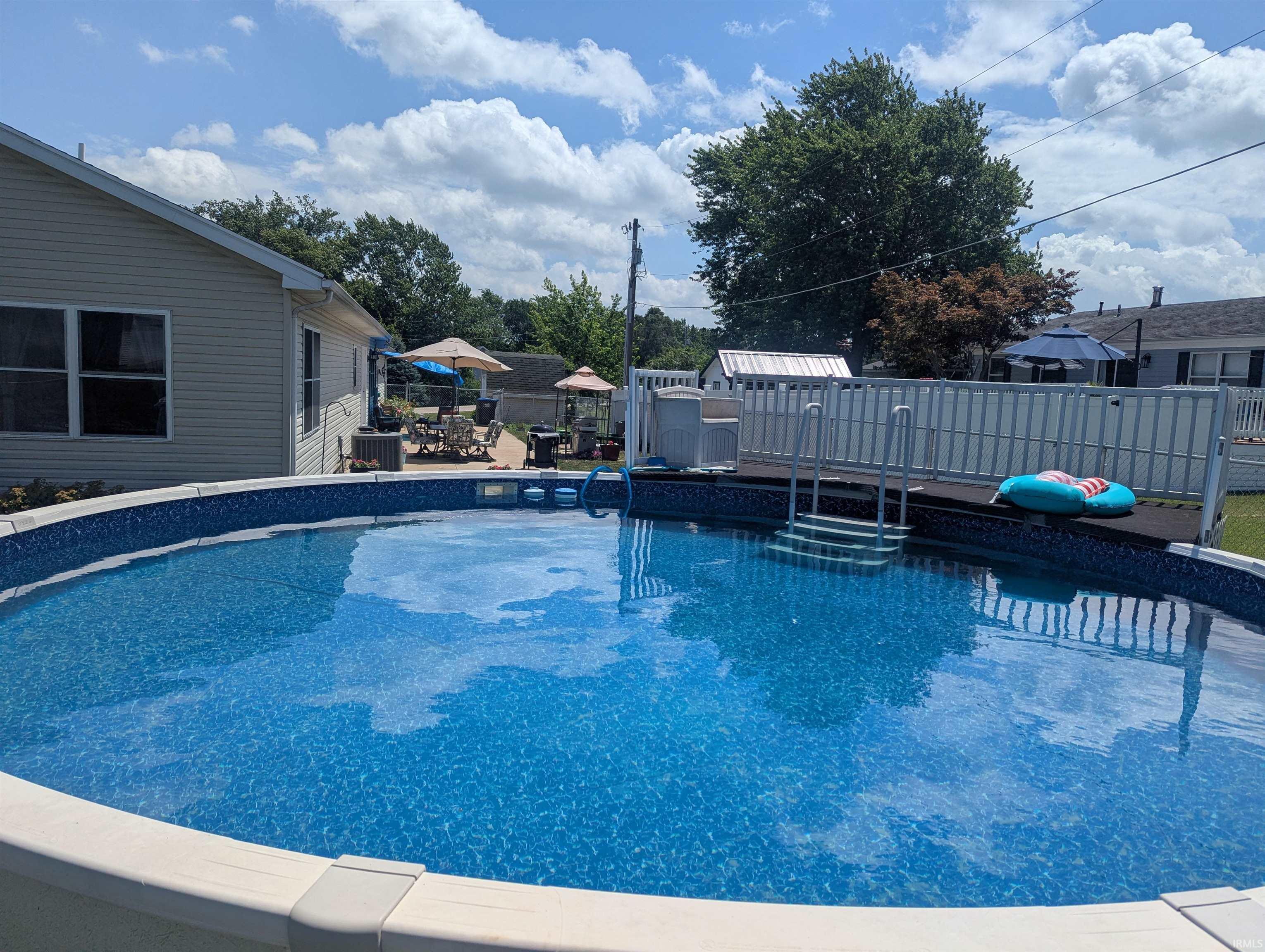View of swimming pool featuring a patio