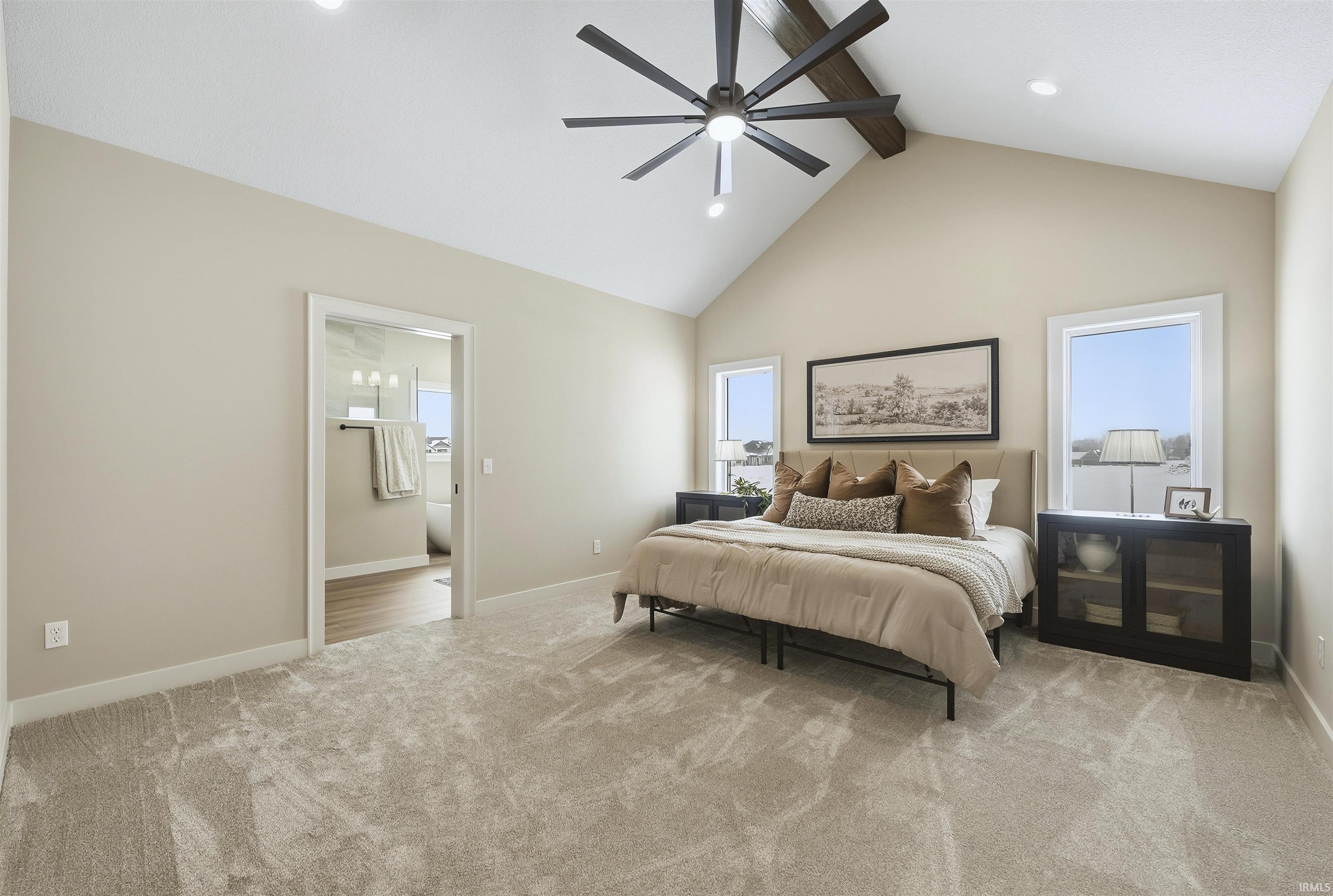 Bedroom with light carpet, ceiling fan, and recessed lighting