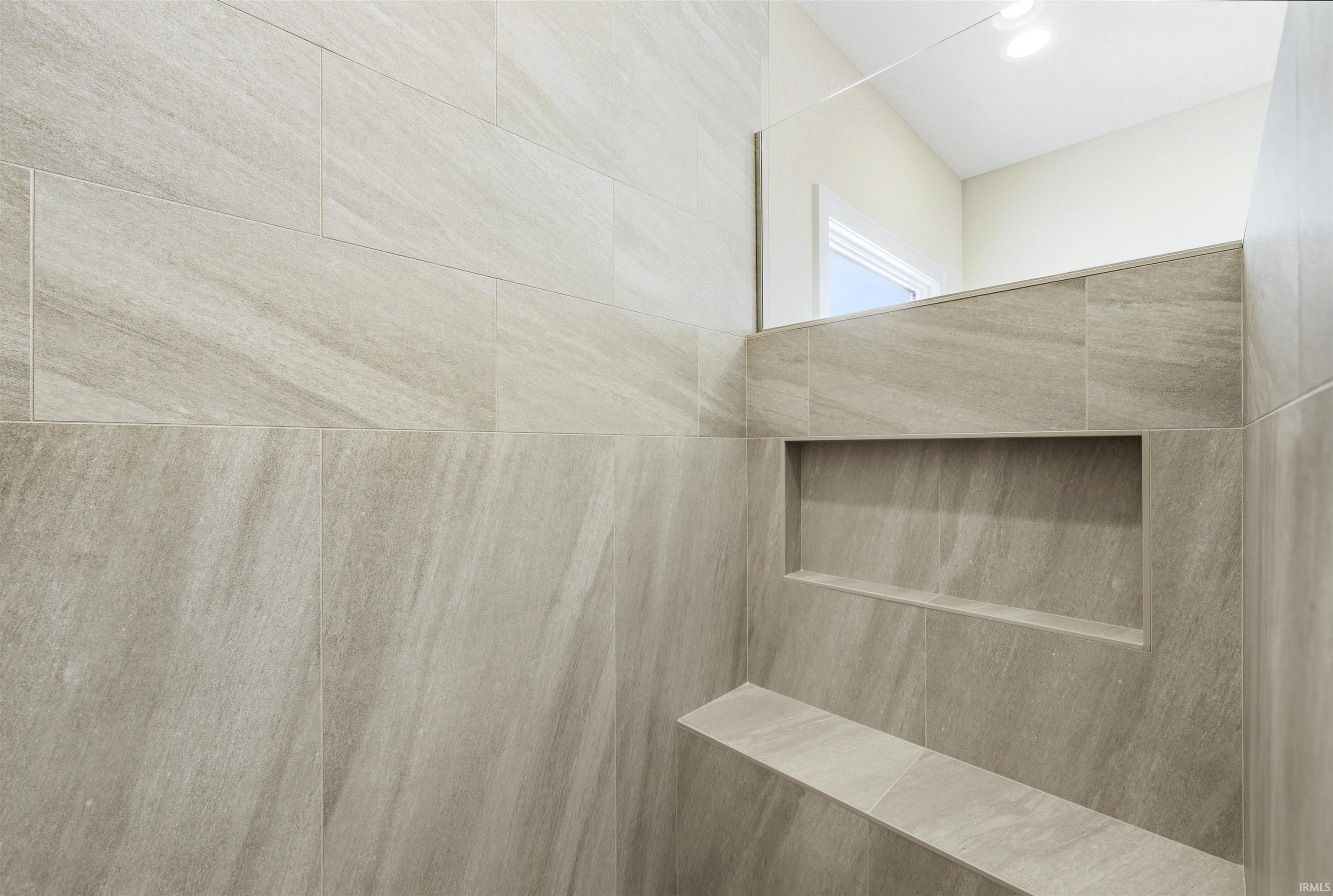 Bathroom view of a tile shower