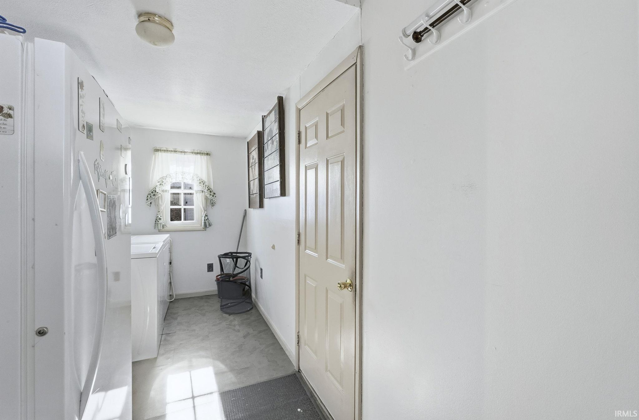Bathroom with vanity and washer / clothes dryer