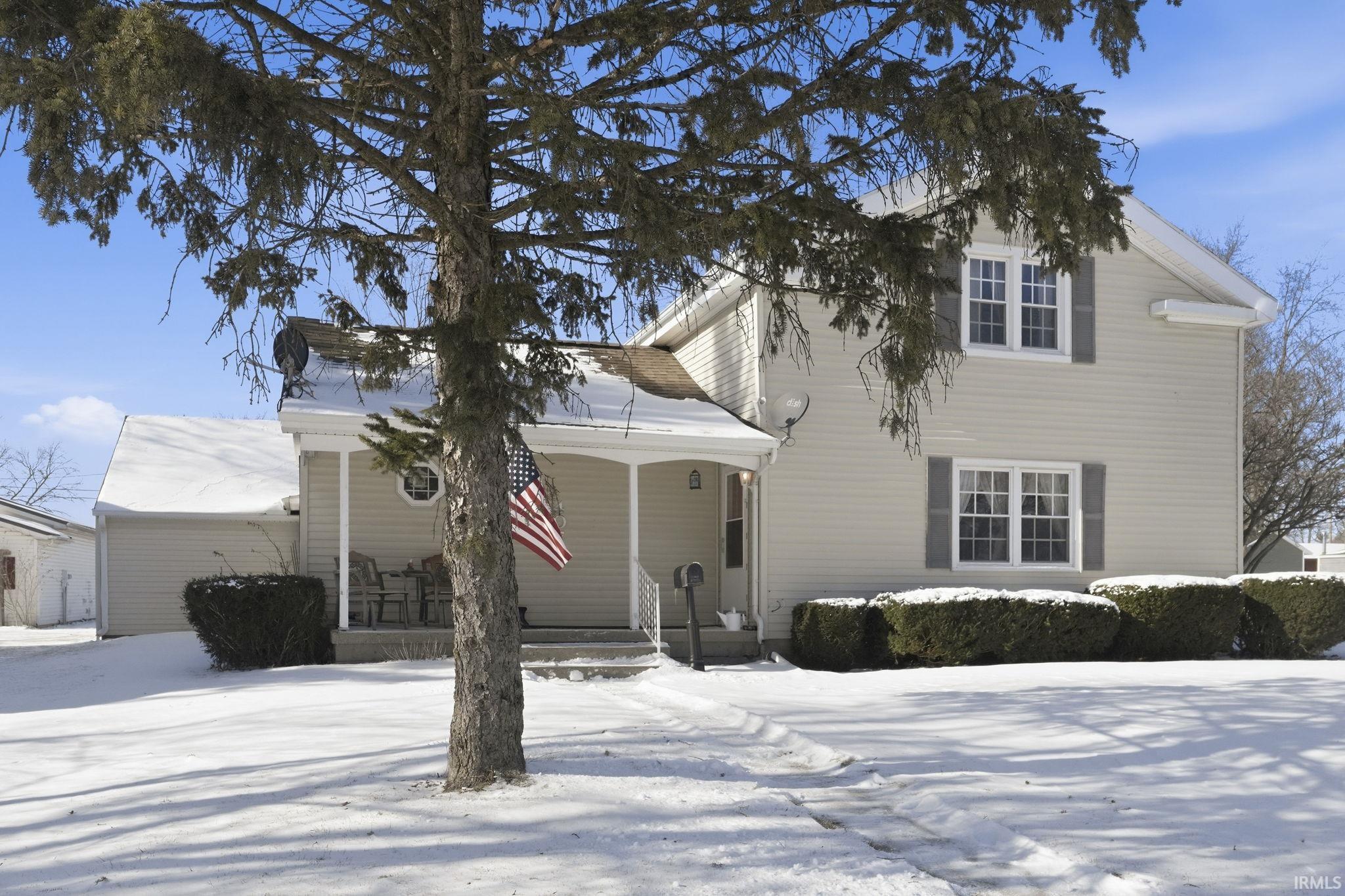 Traditional home with covered porch
