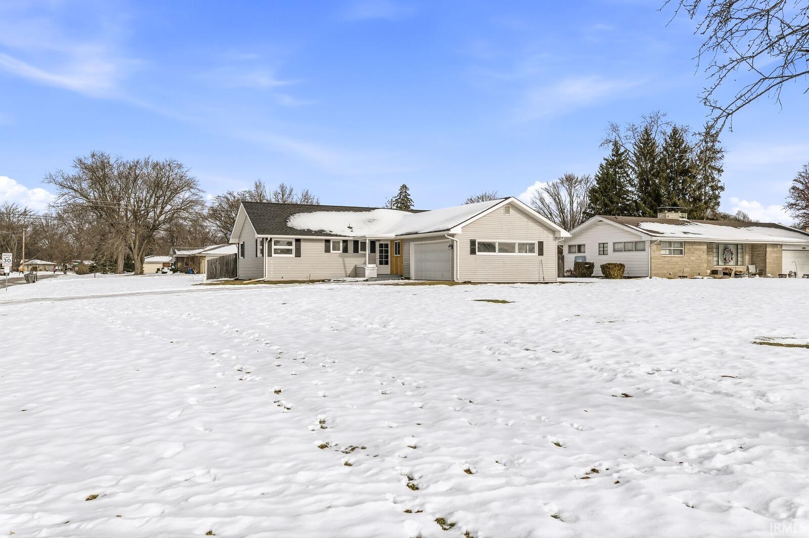 Snow covered house with a chimney