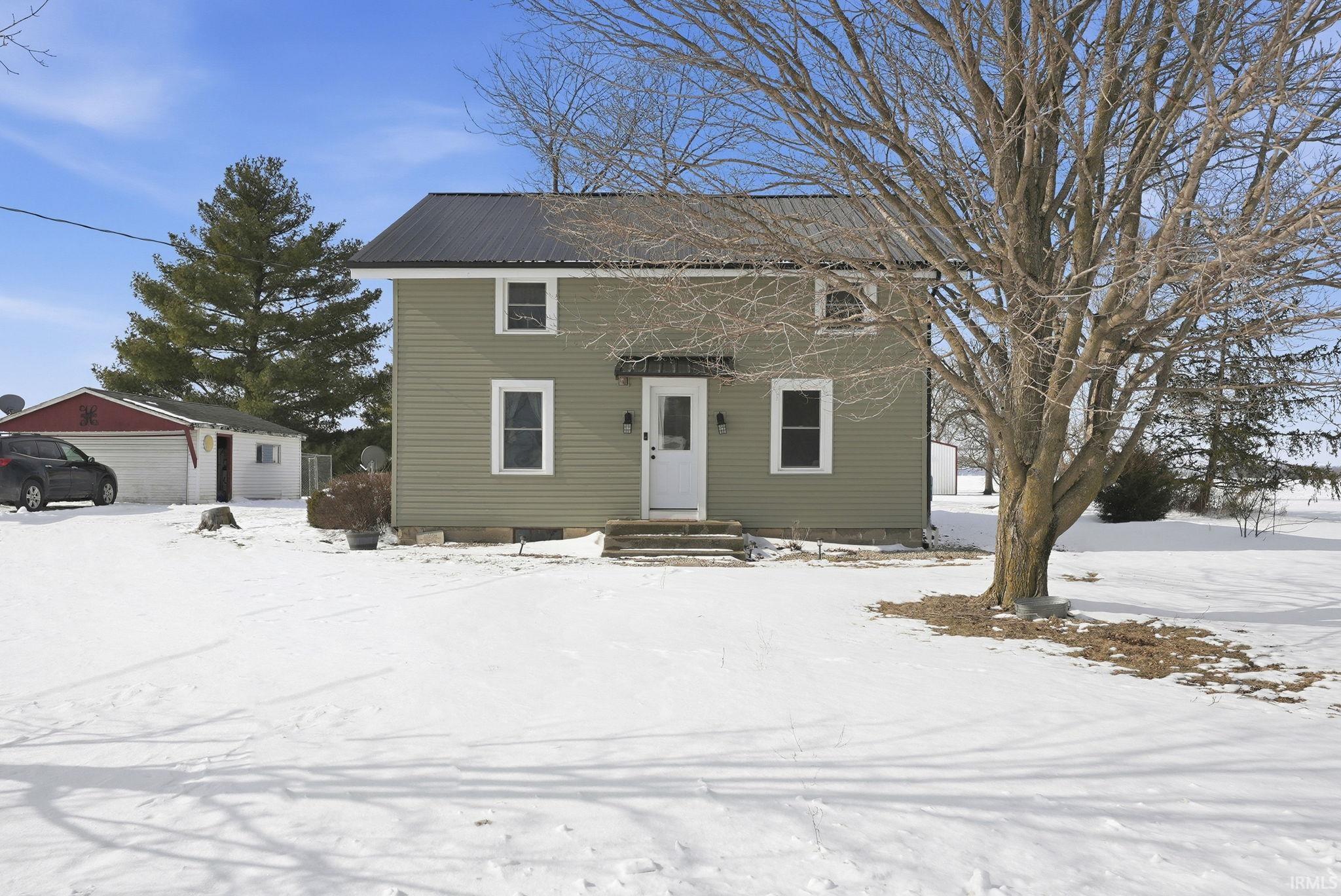 Colonial house with an outdoor structure