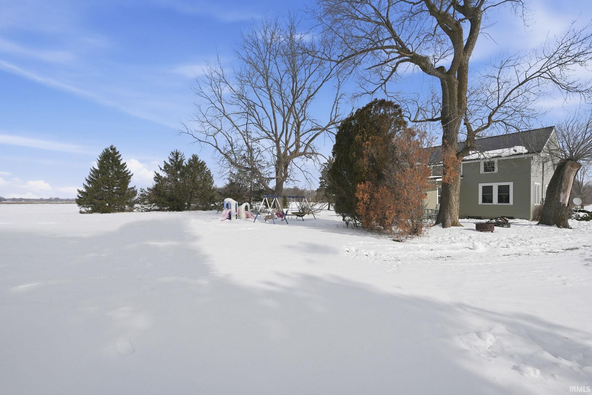 View of yard layered in snow