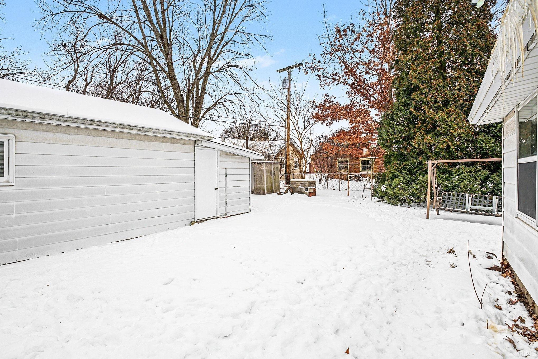 View of yard layered in snow
