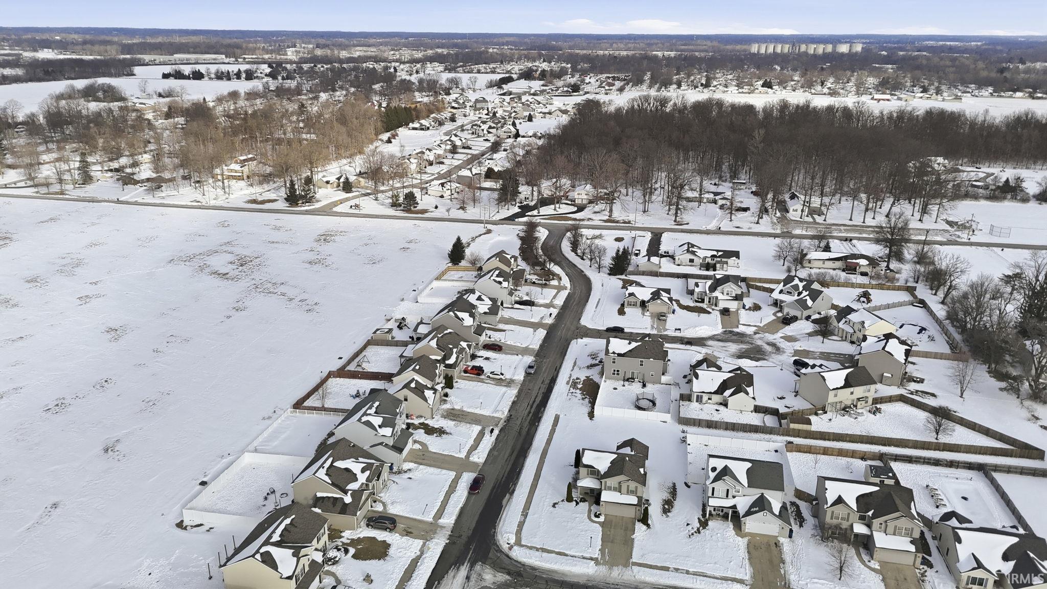 Snowy aerial view with a residential view