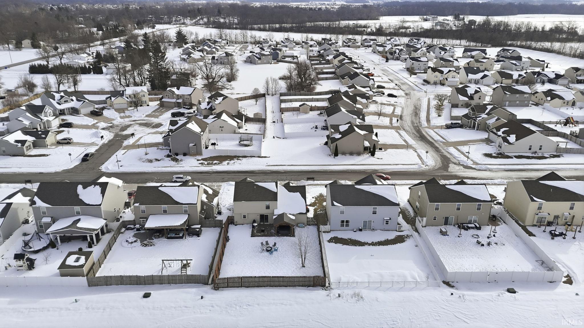 Snowy aerial view with a residential view