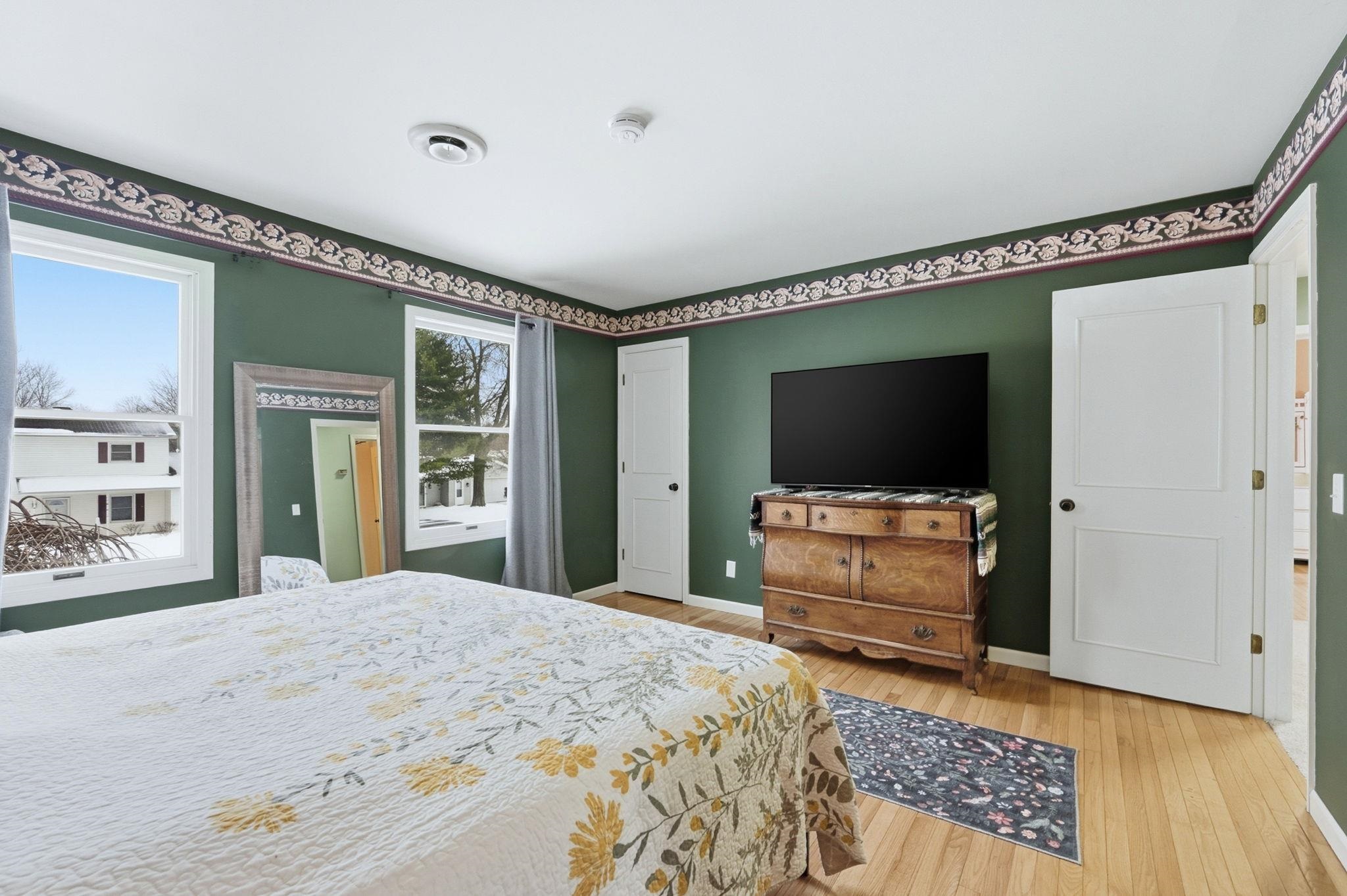 Bedroom with baseboards and light wood-style flooring