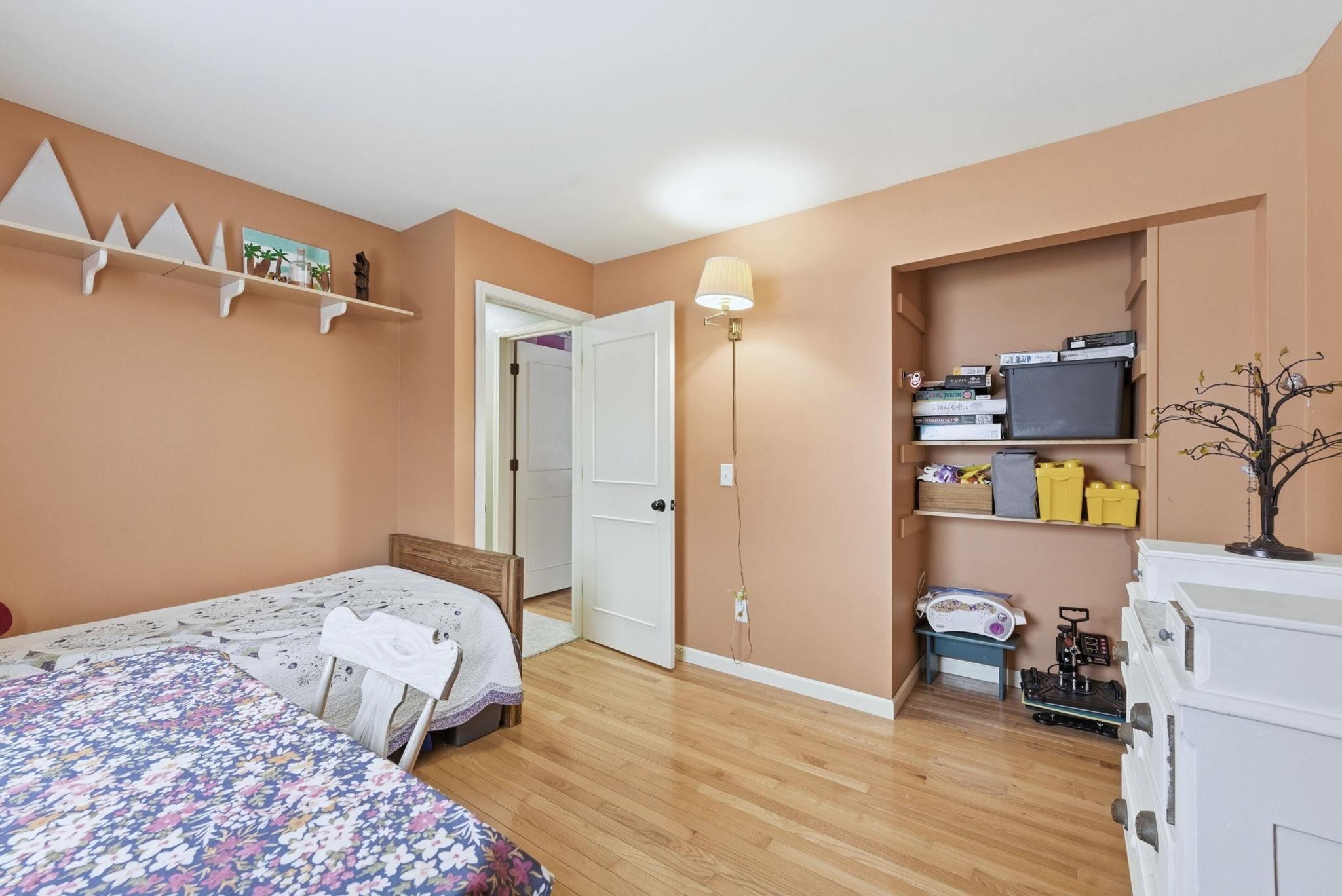 Bedroom with baseboards and light wood-style floors
