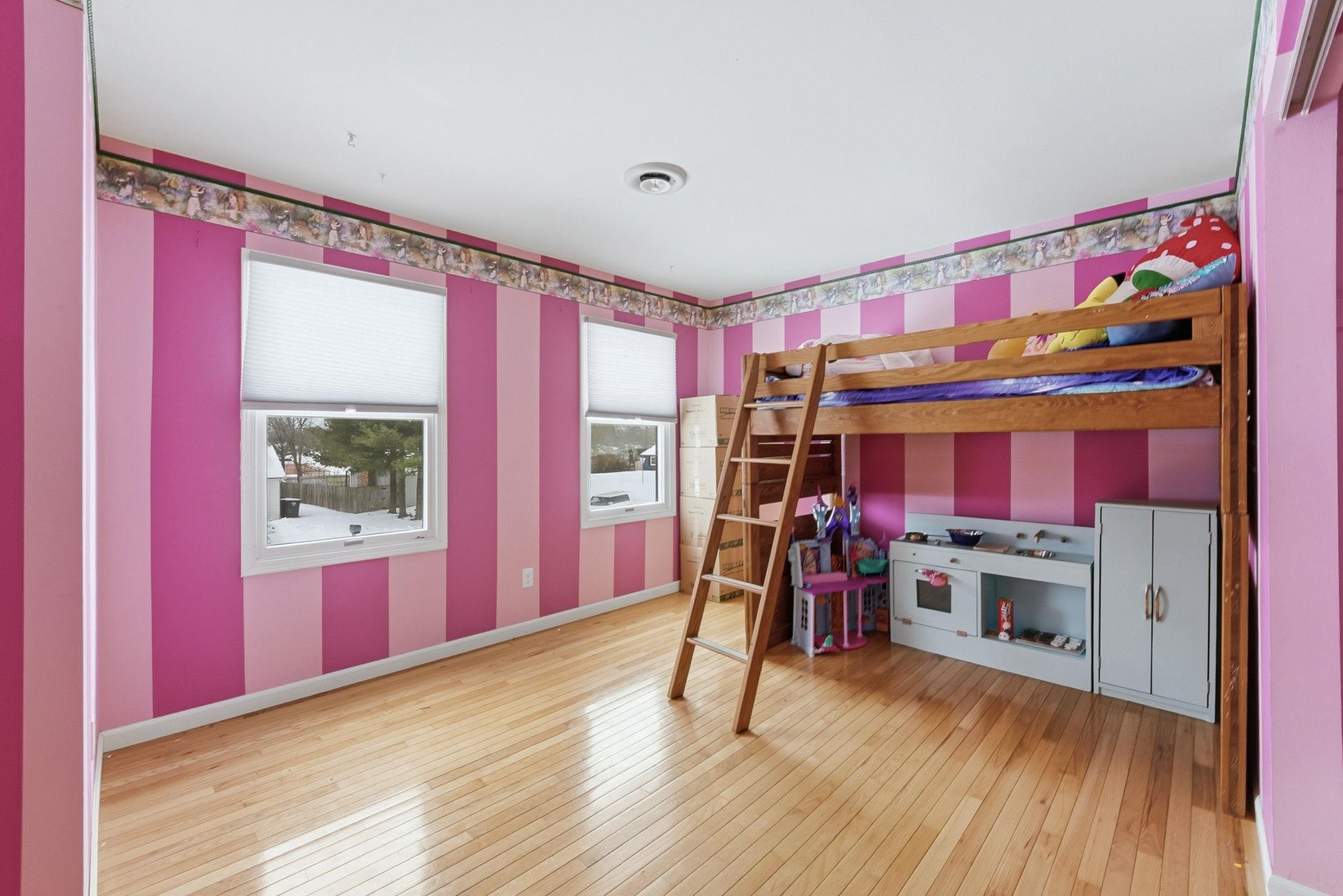 Unfurnished bedroom with light wood-style floors
