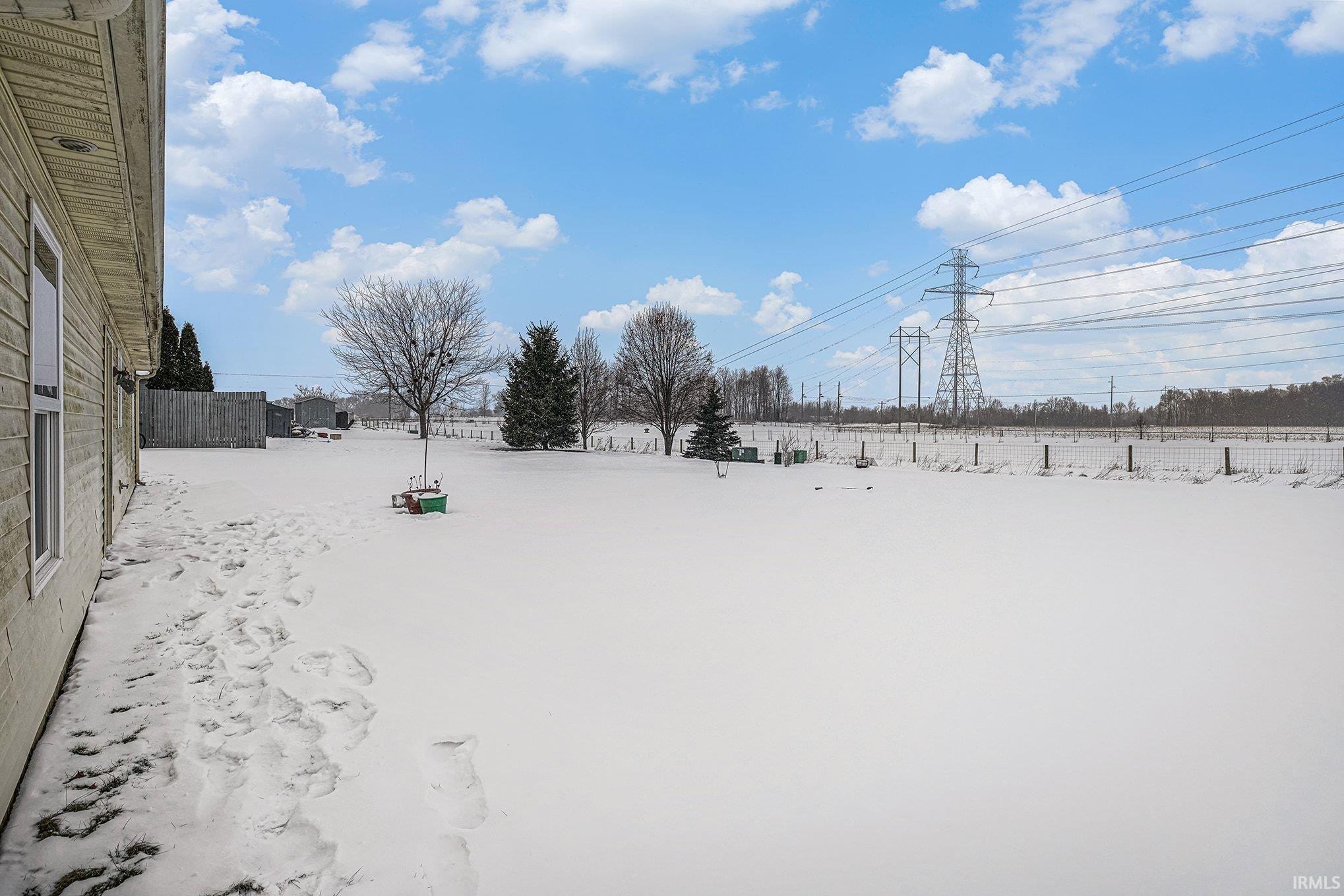 View of yard layered in snow